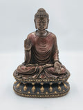 Large polyresin Buddha sculpture seated on ornate base with raised hand