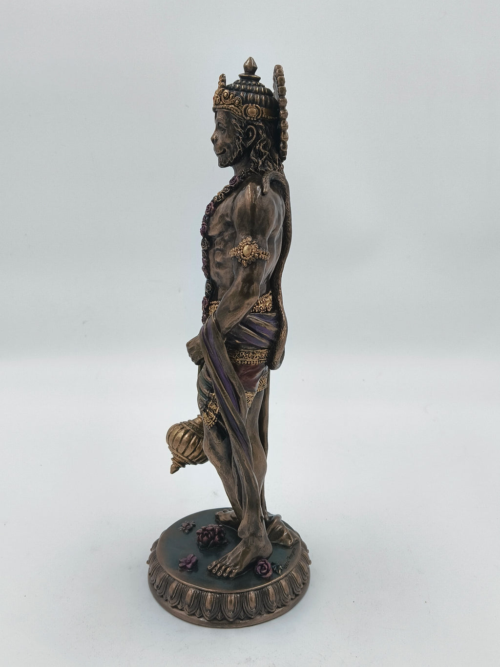Side view of large polyresin standing Hanuman statue with ornate details