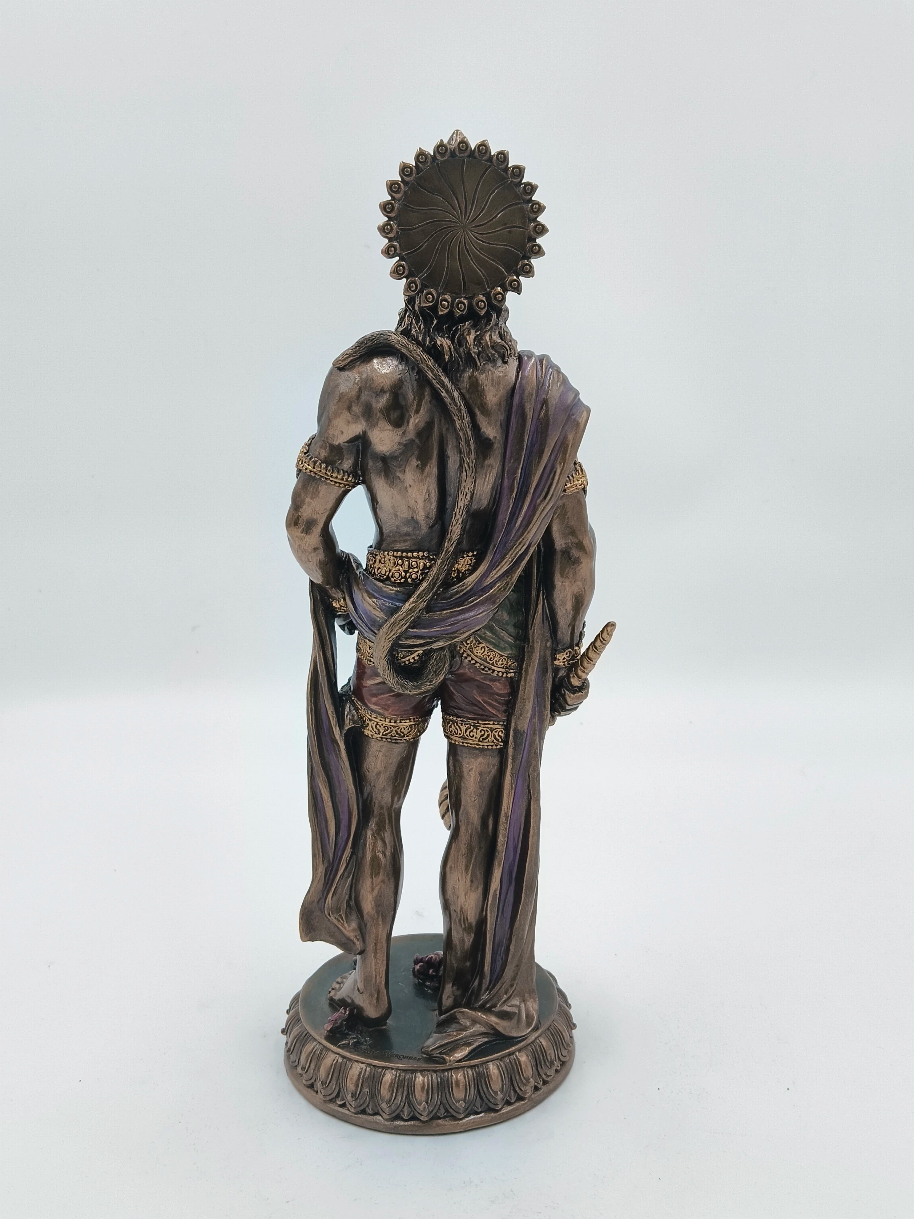 Back view of a large polyresin Hanuman standing statue with detailed clothing and accessories