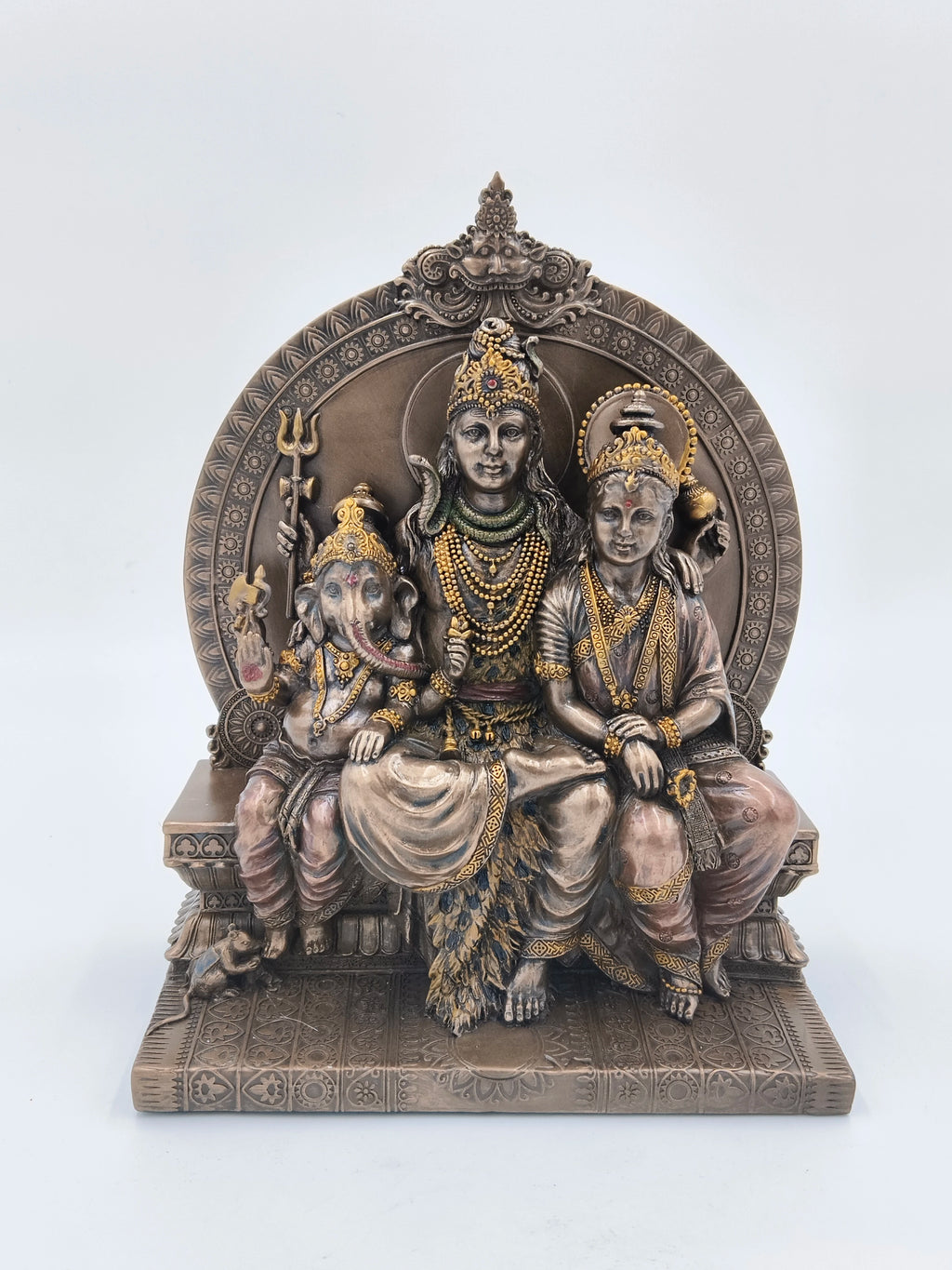 Polyresin sculpture of Shiva family seated on an ornate sinhasan with intricate detailing