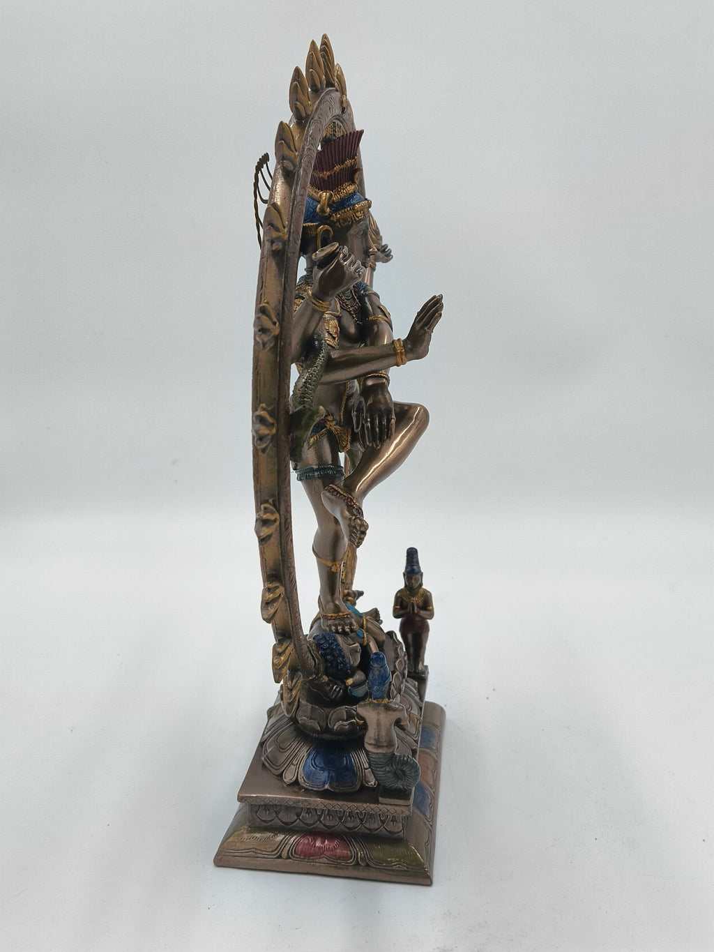 Side view of large polyresin Natraj sculpture with detailed base and decorative elements