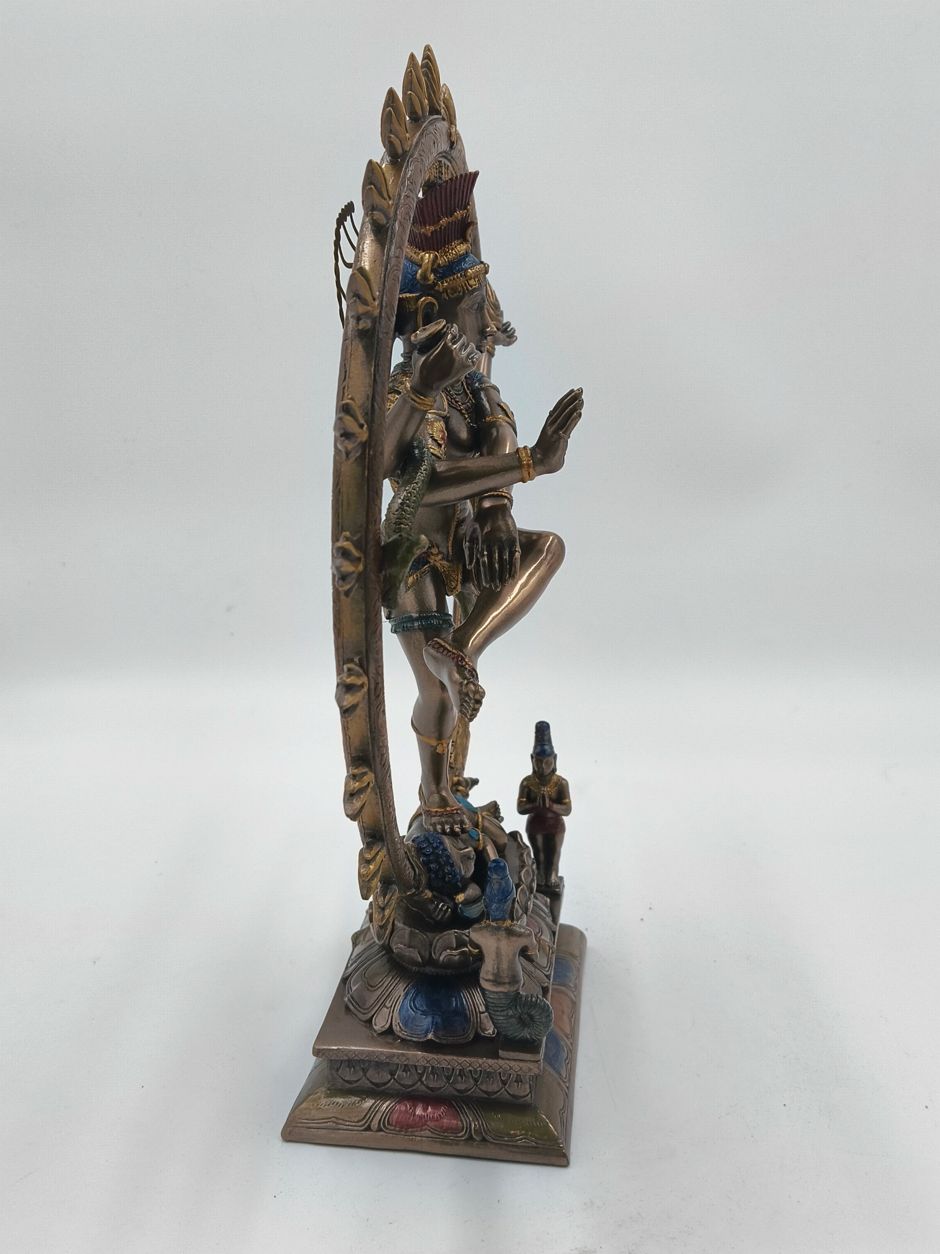 Side view of large polyresin Natraj sculpture with detailed base and decorative elements