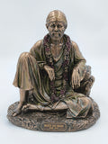 Large polyresin statue of Shirdi Sai Baba seated with flower garland