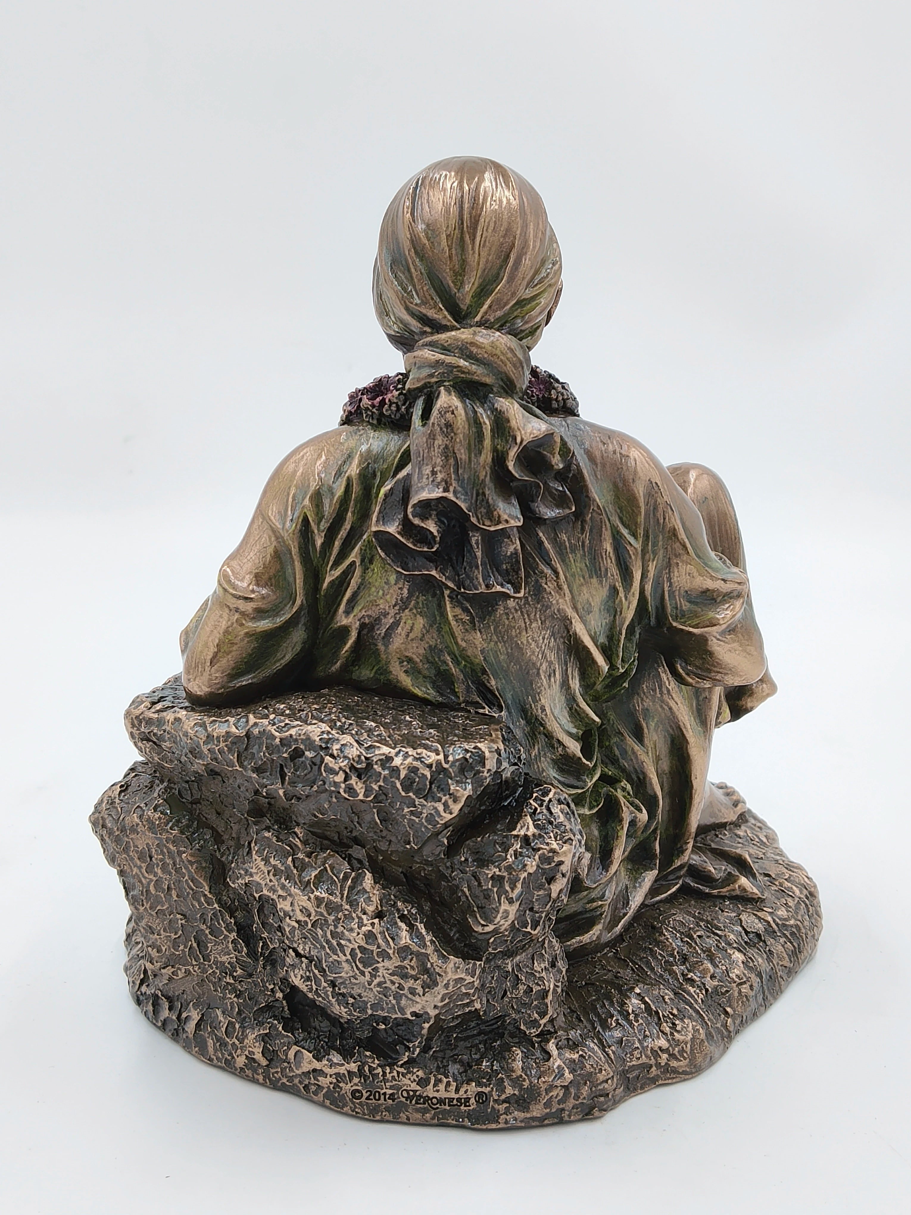 Back view of large polyresin Shirdi Sai Baba statue seated on textured base