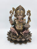 Front view of large polyresin Ganesh statue seated on a lotus with intricate details