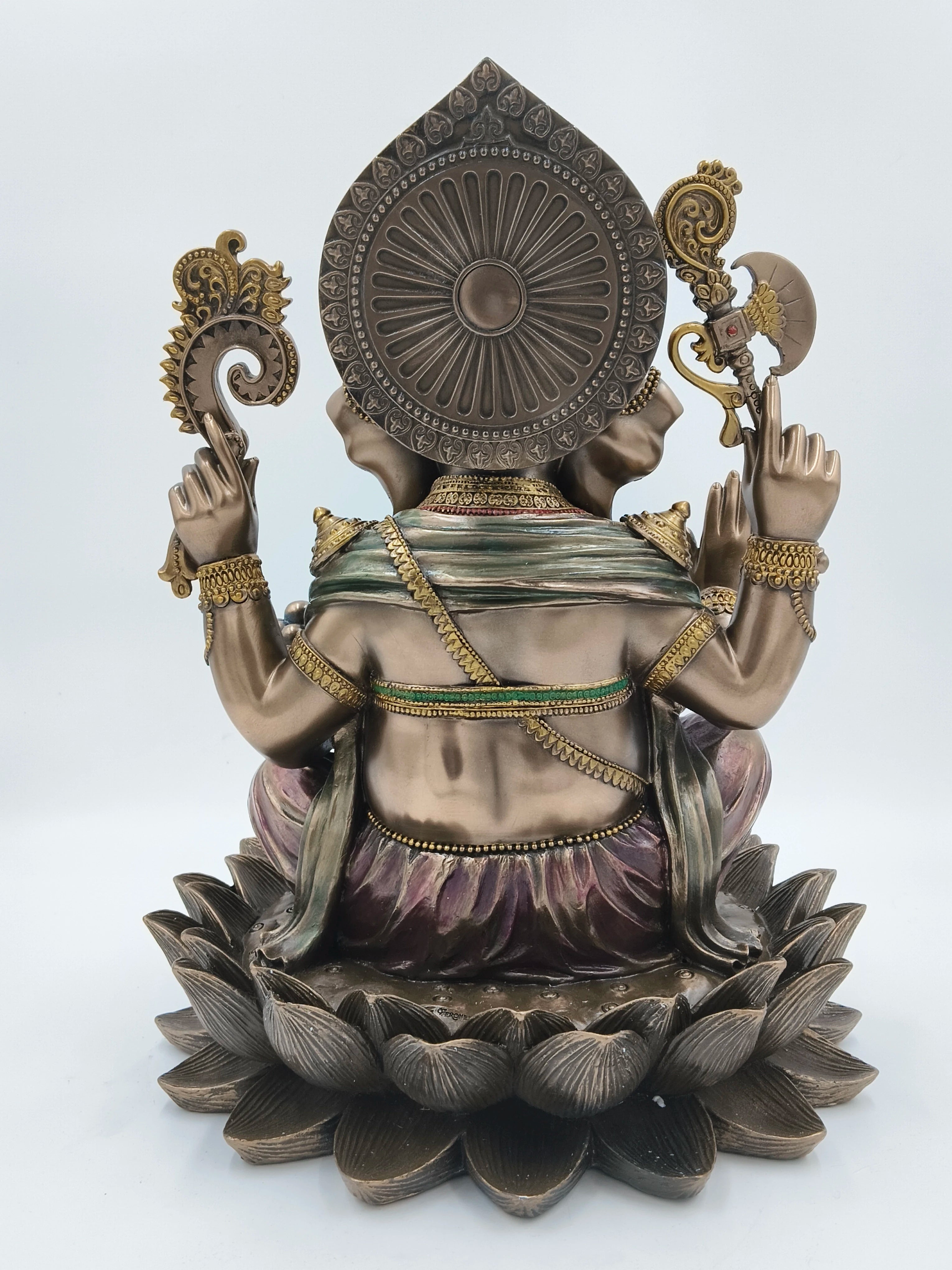 Back view of a large polyresin Ganesh sculpture seated on a lotus base