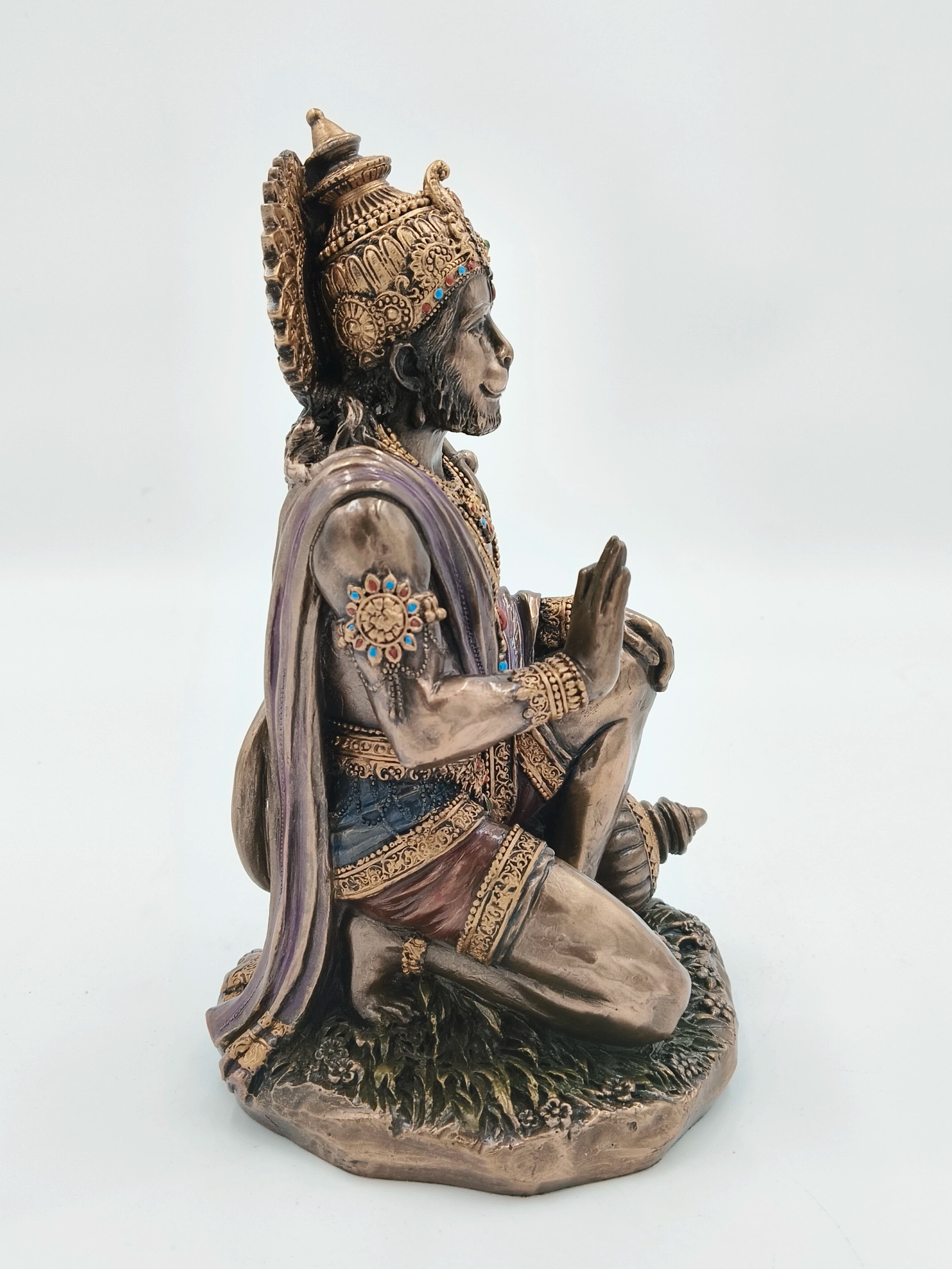 Side view of large polyresin Hanuman statue with detailed ornamentation and painted accents