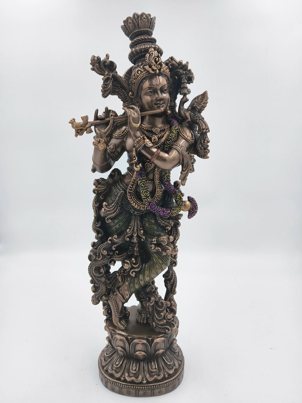 large polyresin Krishna statue playing flute with detailed ornaments and base