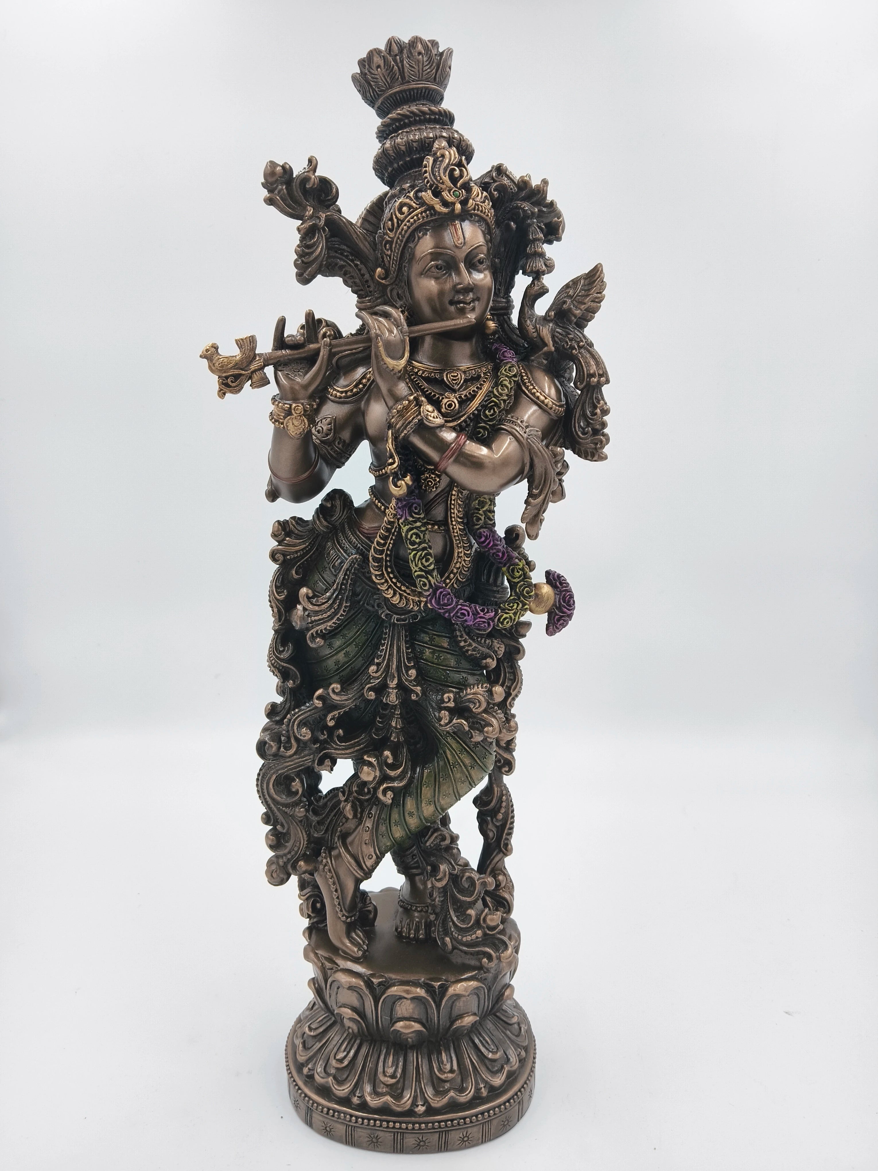 large polyresin Krishna statue playing flute with detailed ornaments and base