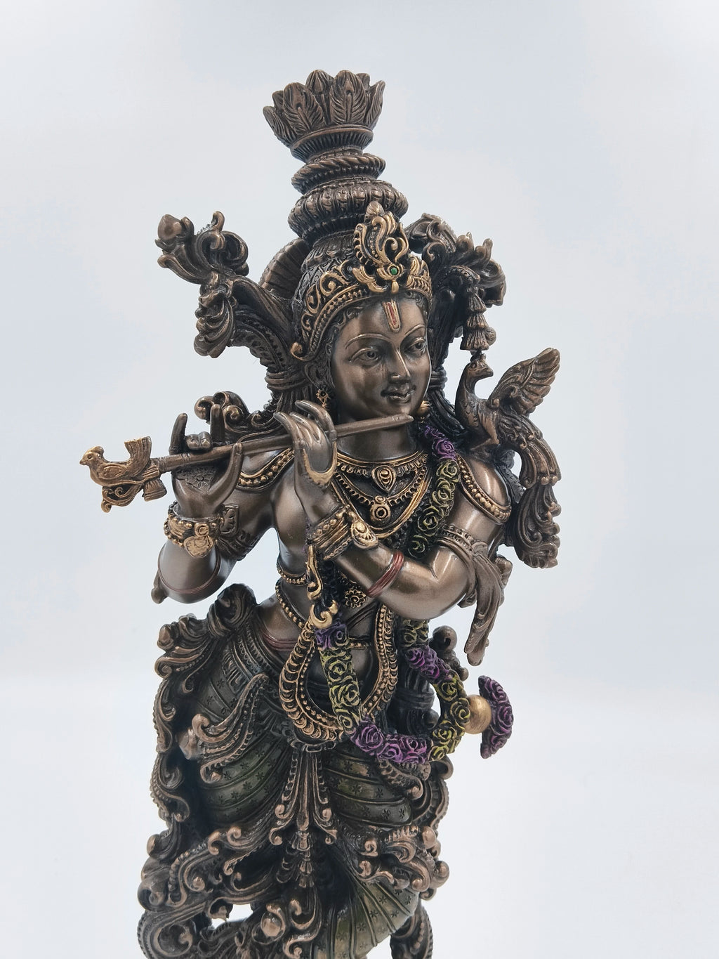 Large polyresin statue of Krishna playing flute with intricate details