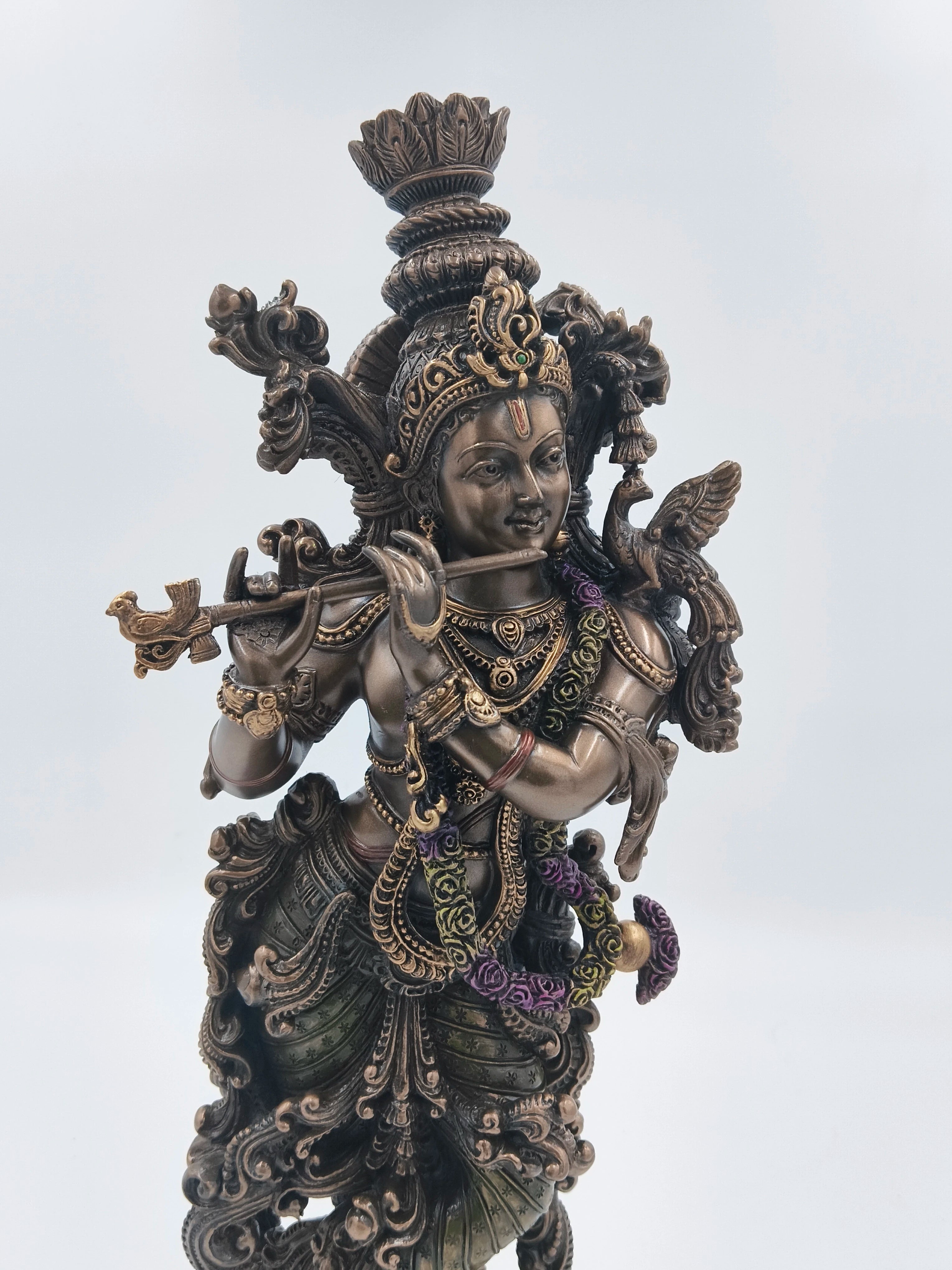Large polyresin statue of Krishna playing flute with intricate details