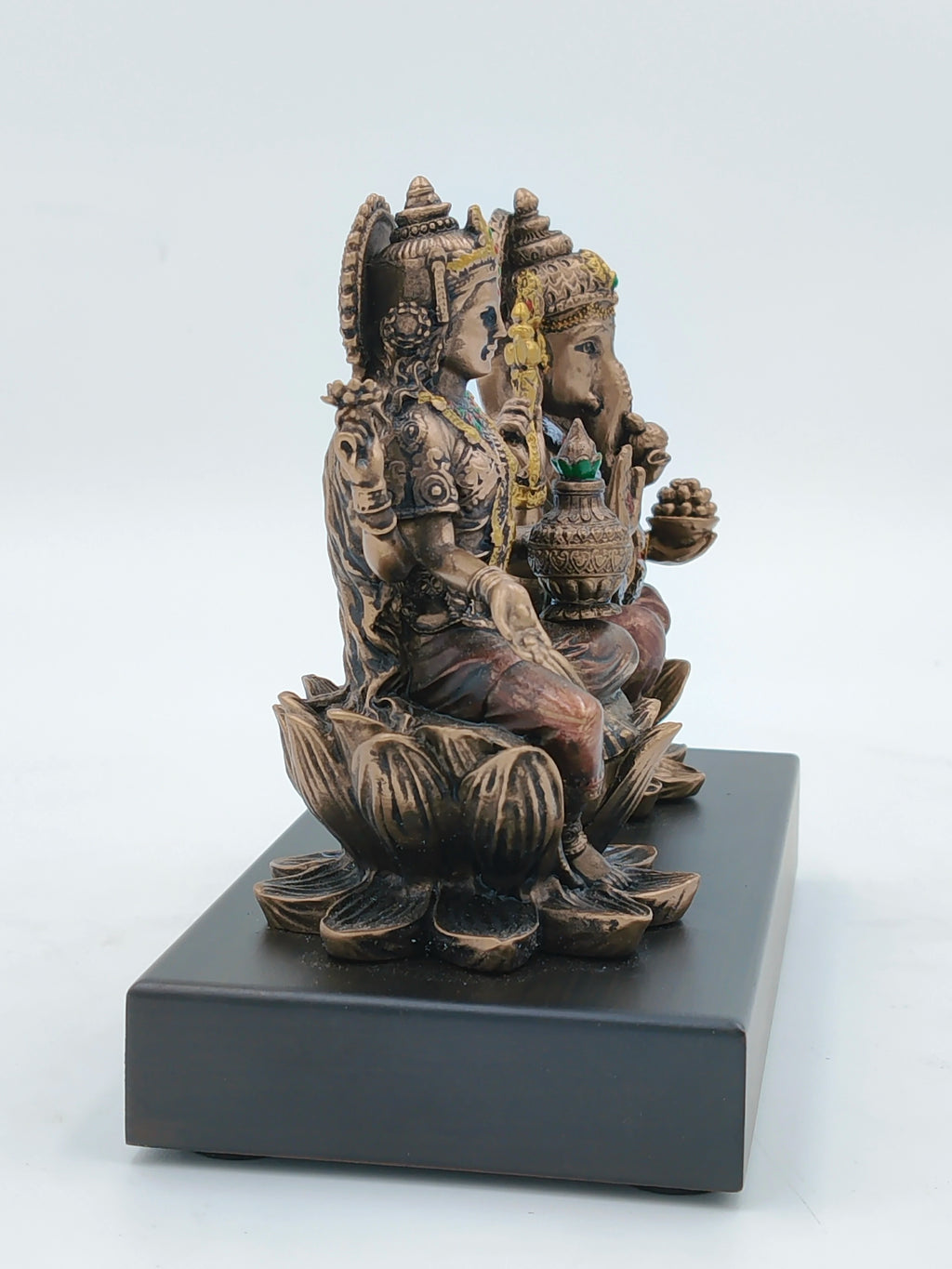 Small polyresin sculpture of Lord Ganesh and Goddess Lakshmi seated on lotus