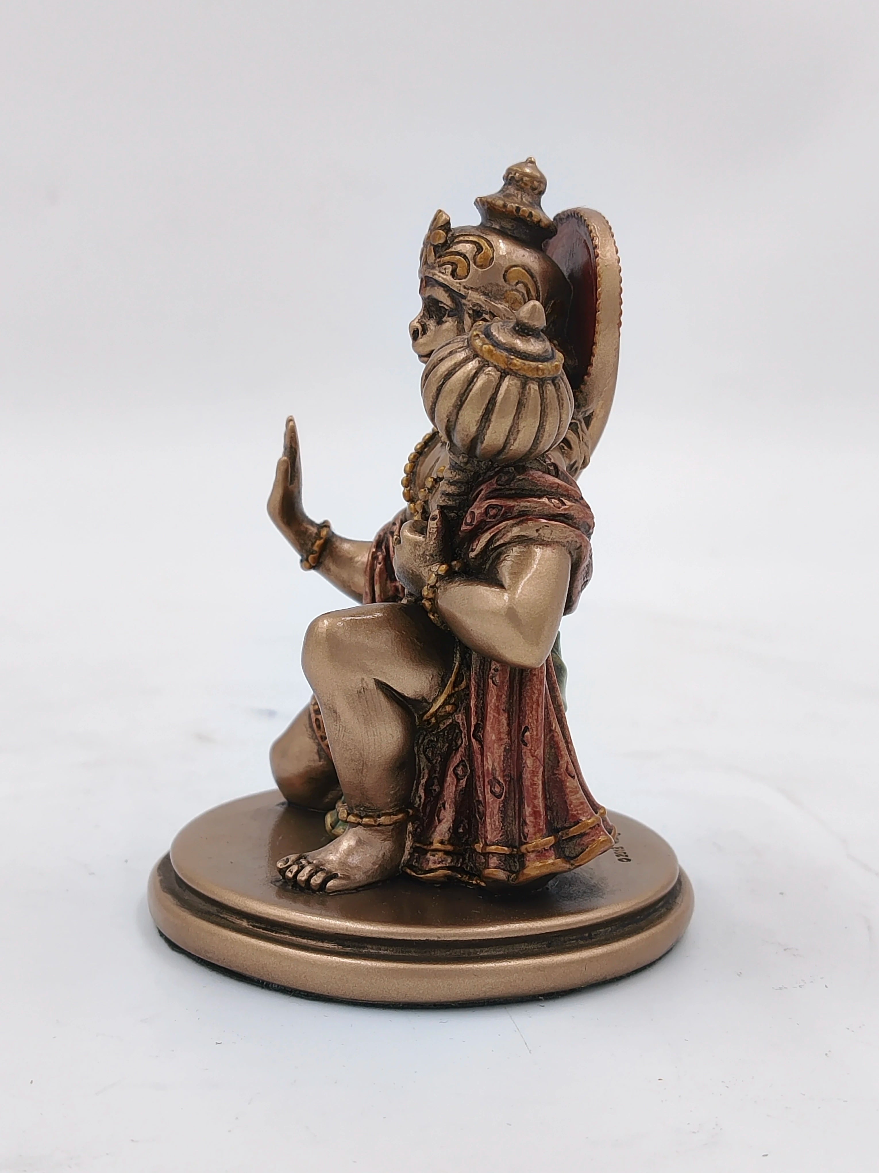 Small polyresin Hanuman statue kneeling with mace on round base side view