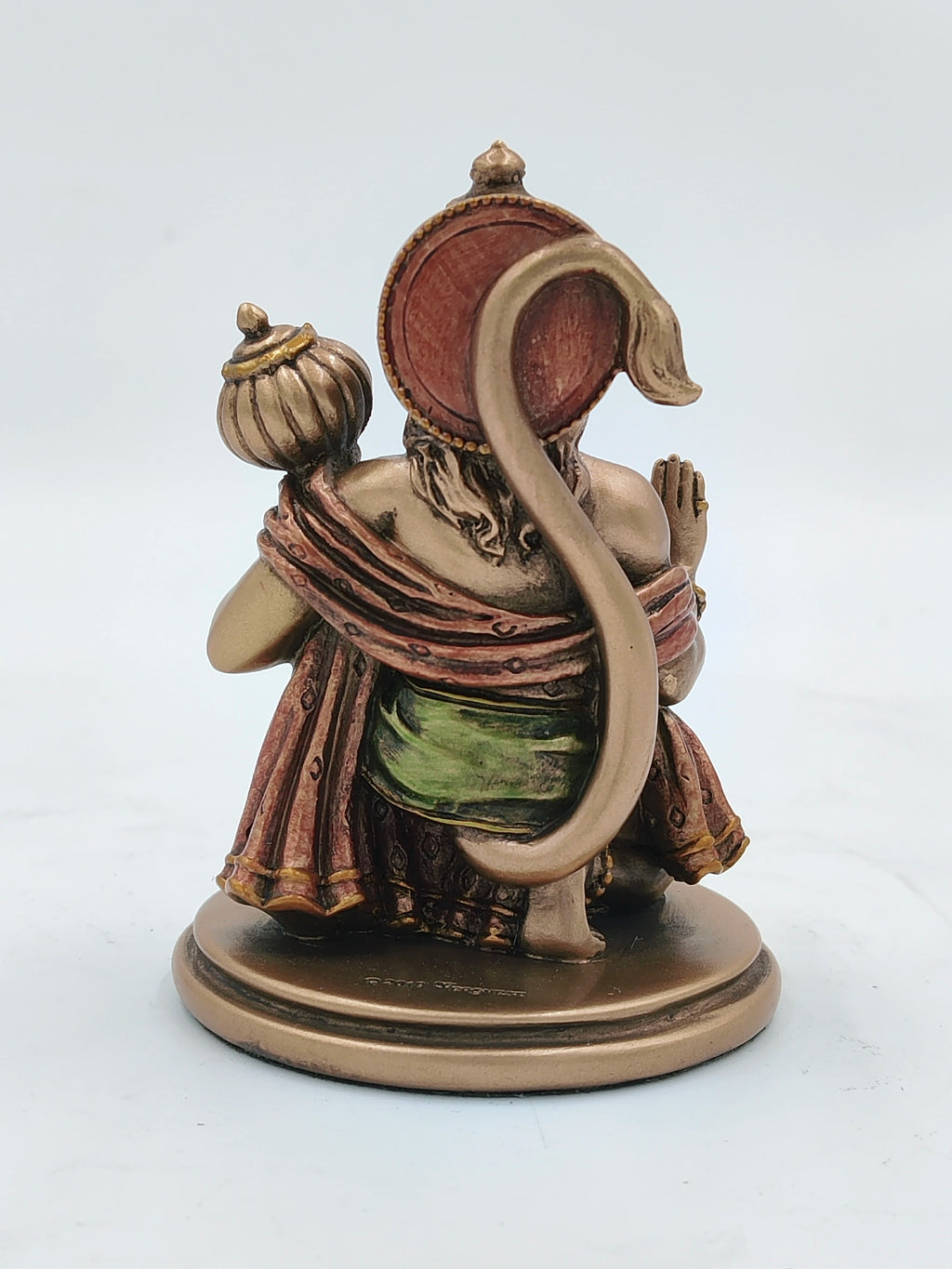 Back view of small polyresin Hanuman statue with raised tail and mace