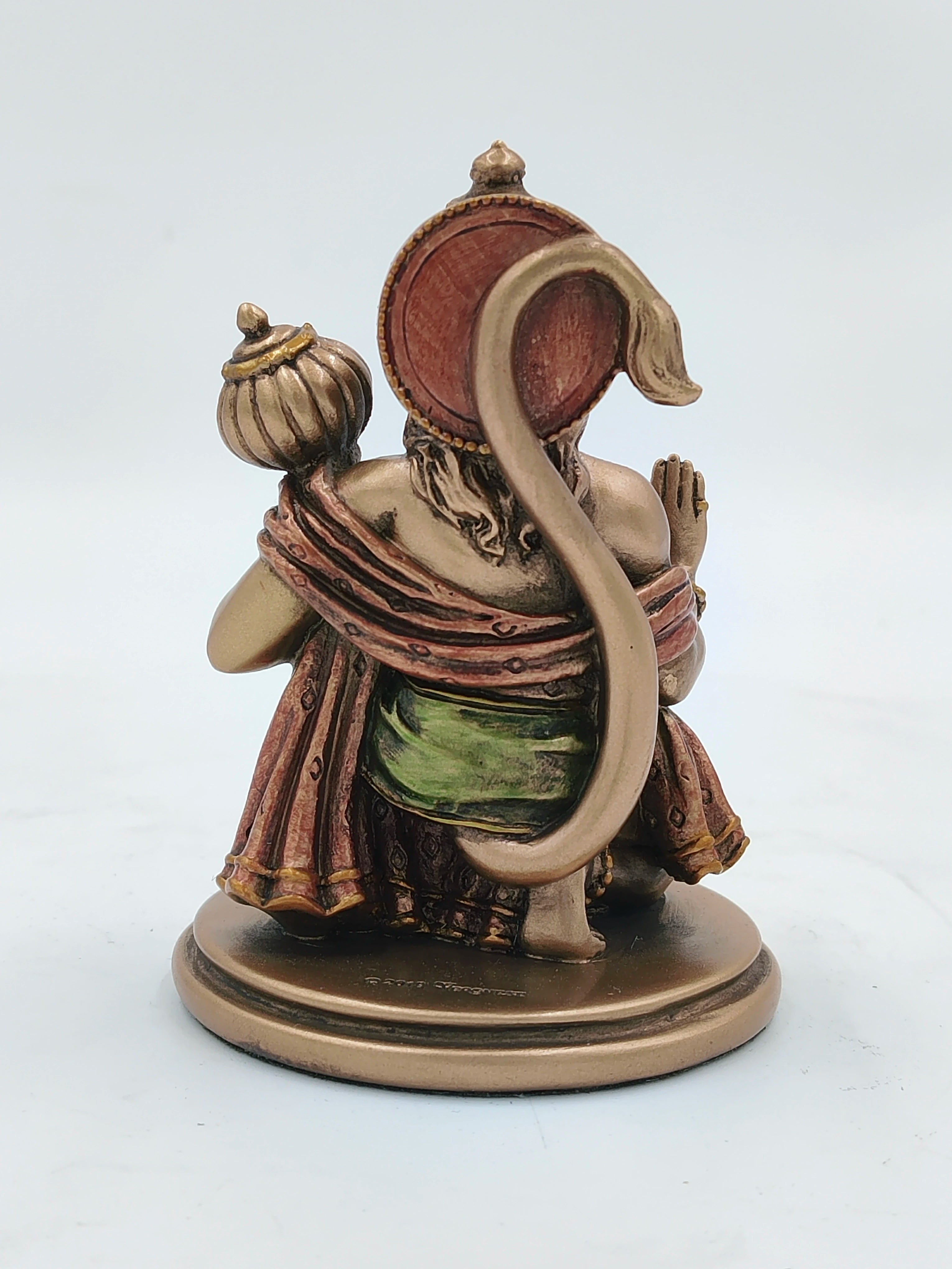 Back view of small polyresin Hanuman statue with raised tail and mace