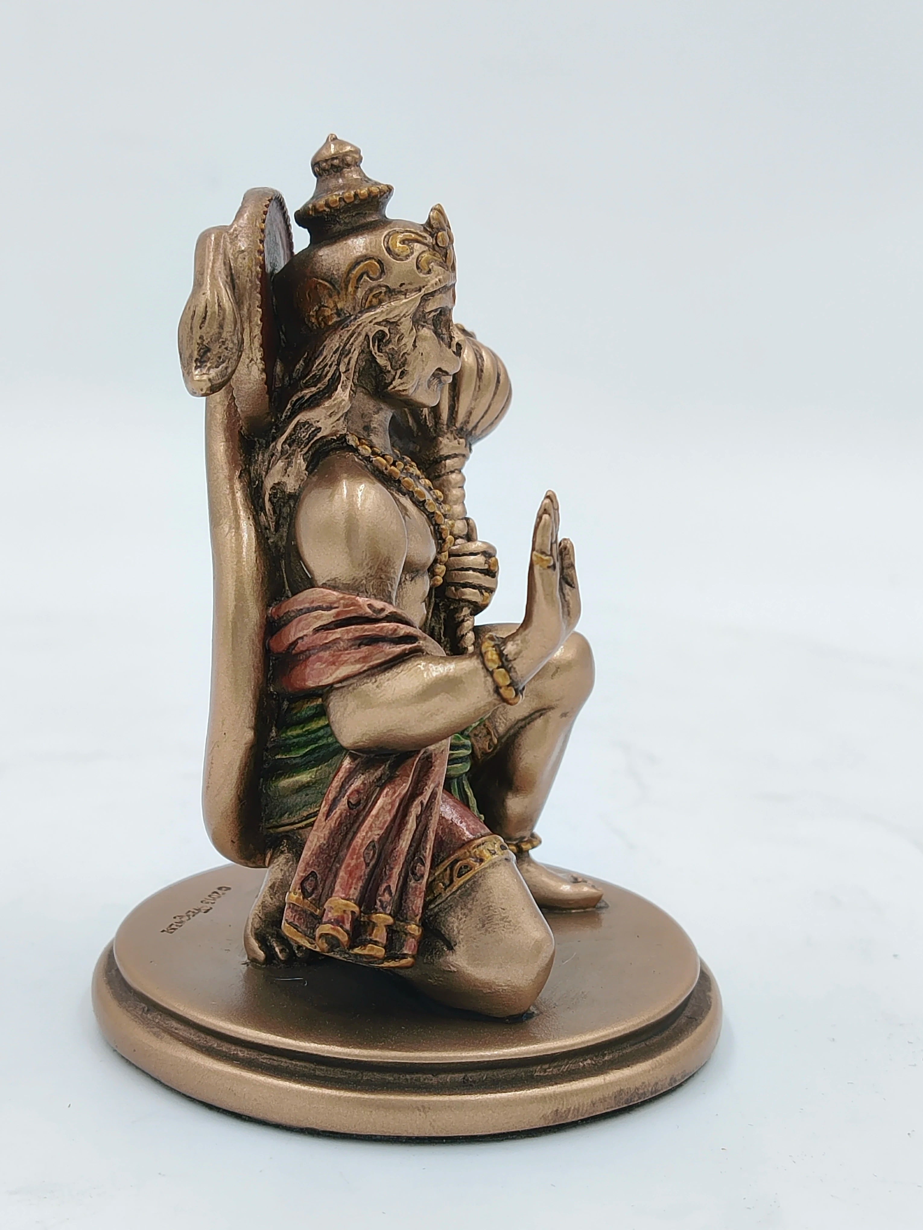 Small polyresin tabletop Hanuman statue in a seated pose side view