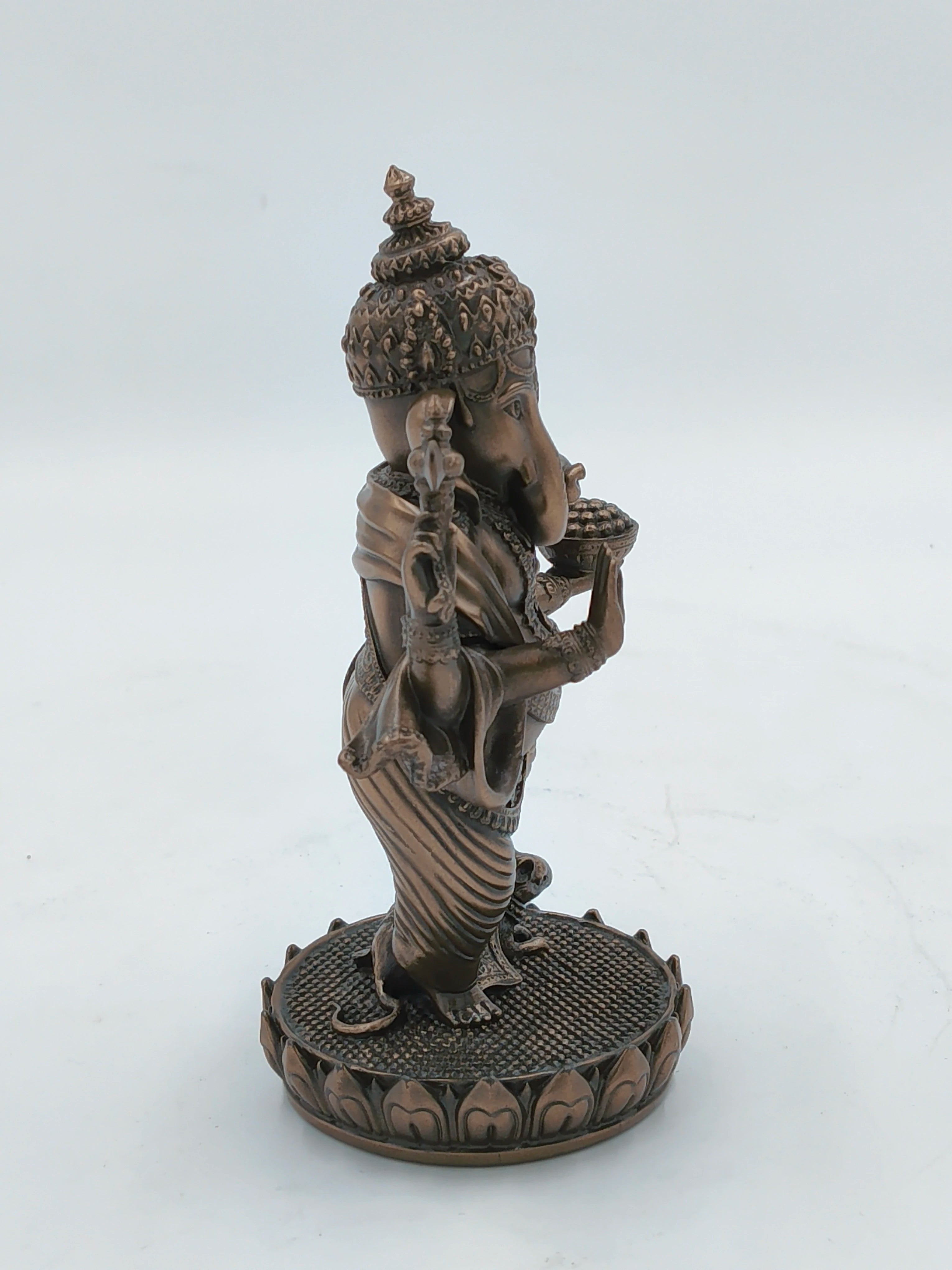 Side view of medium polyresin standing Ganesh statue on lotus base
