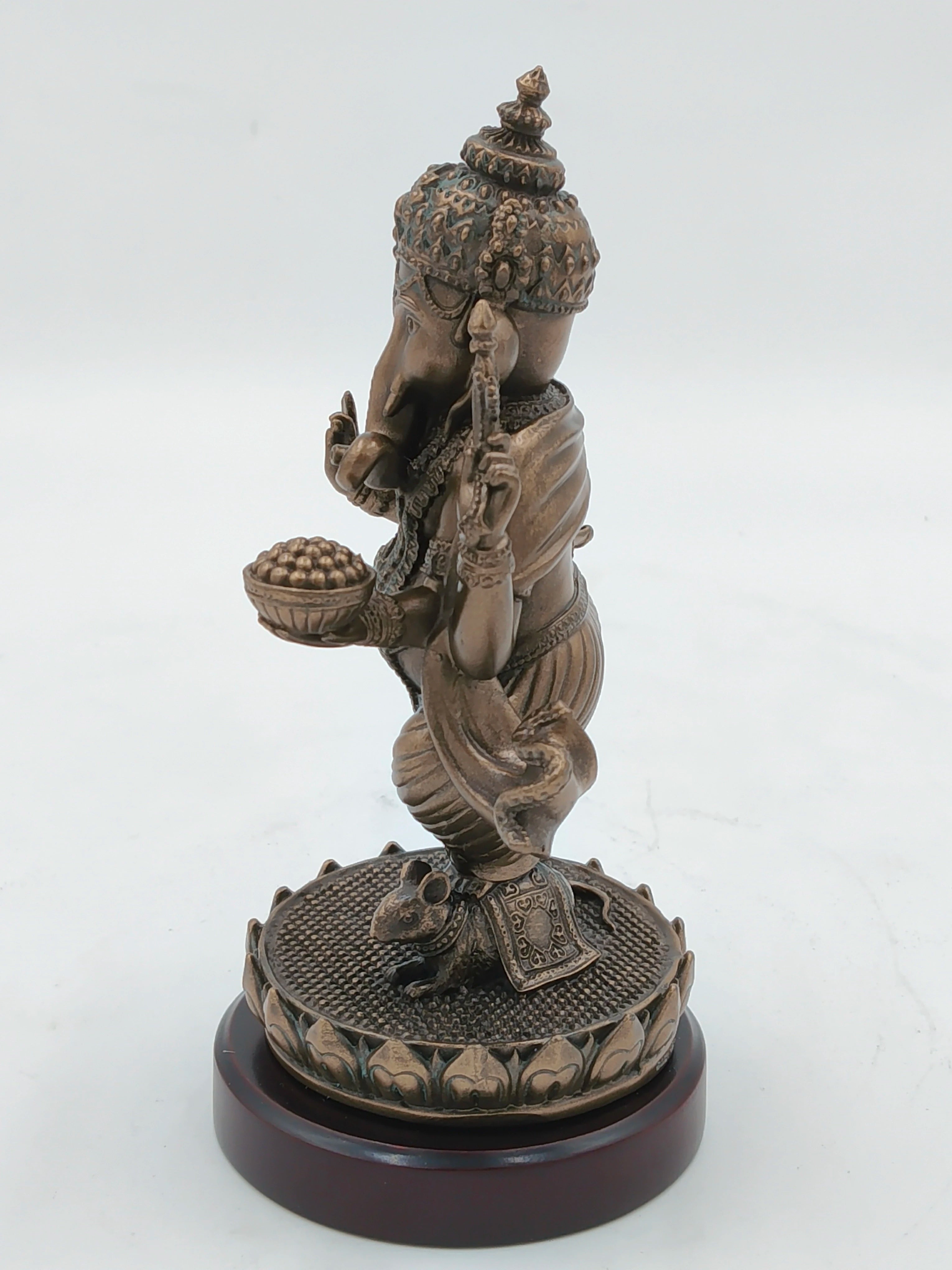 Side view of medium polyresin standing Ganesh statue on decorative base