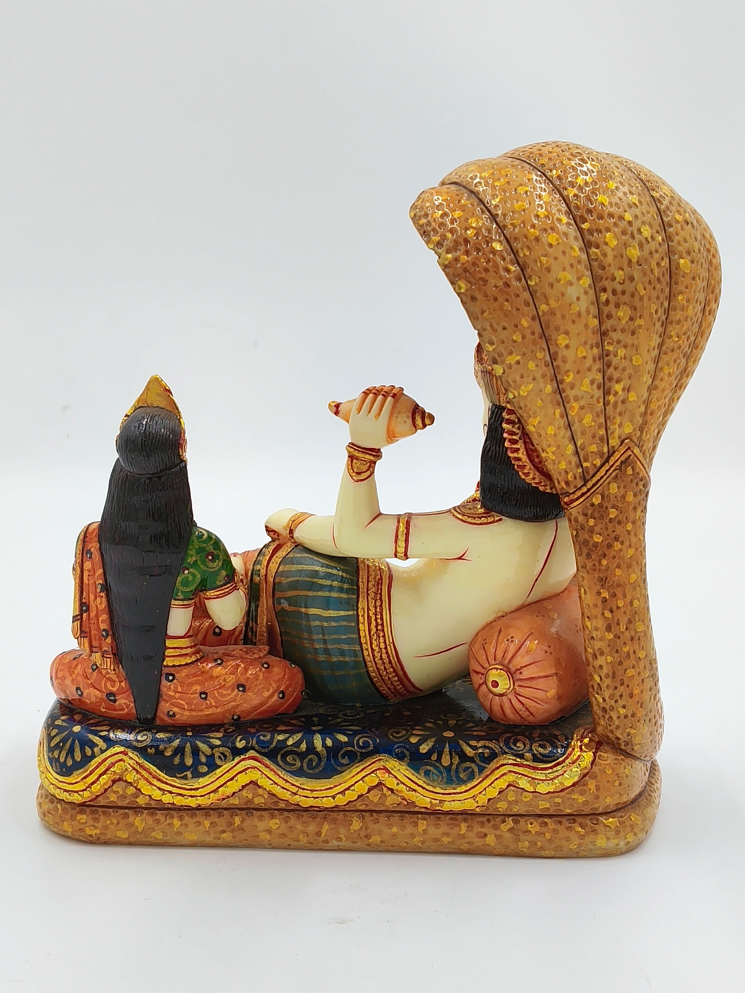 Rear view of large polyresin Vishnu Lakshmi sculpture with detailed gold and colorful patterns