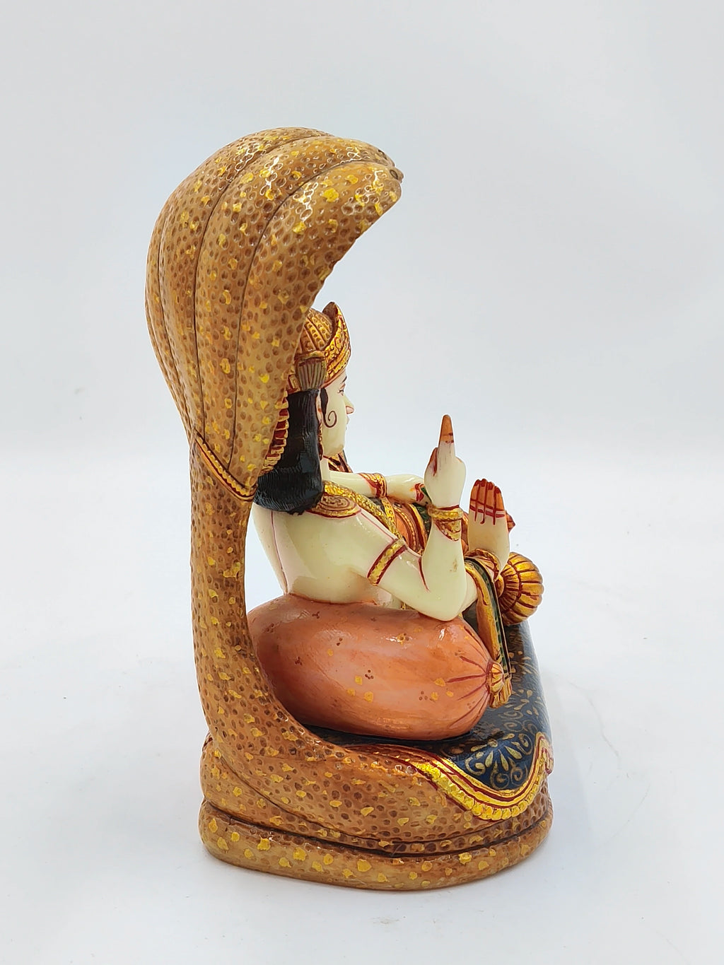 Side view of large polyresin Vishnu Lakshmi sculpture with detailed cobra hood
