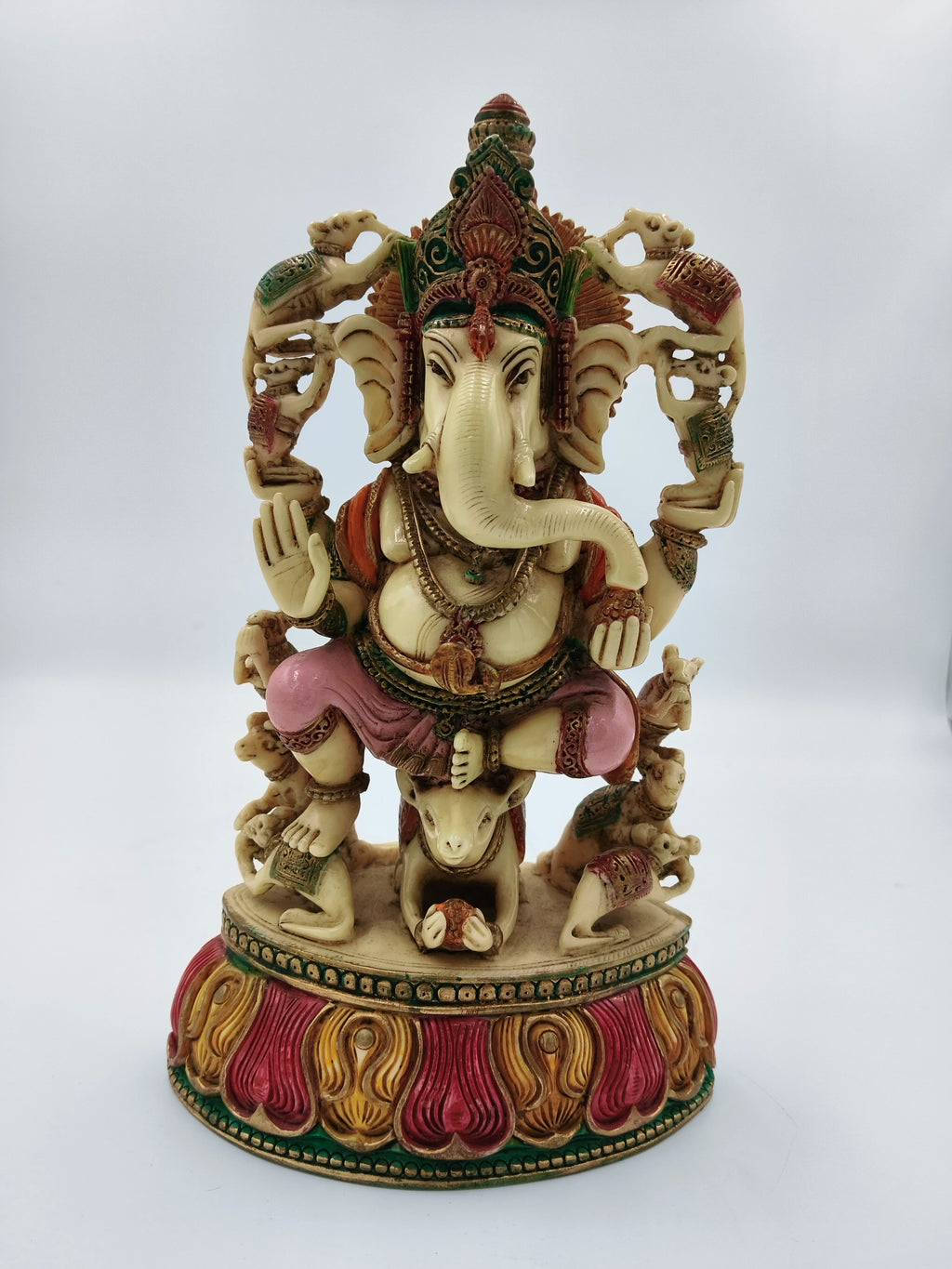 Large polyresin Ganesh statue seated on rat with colorful intricate decorations