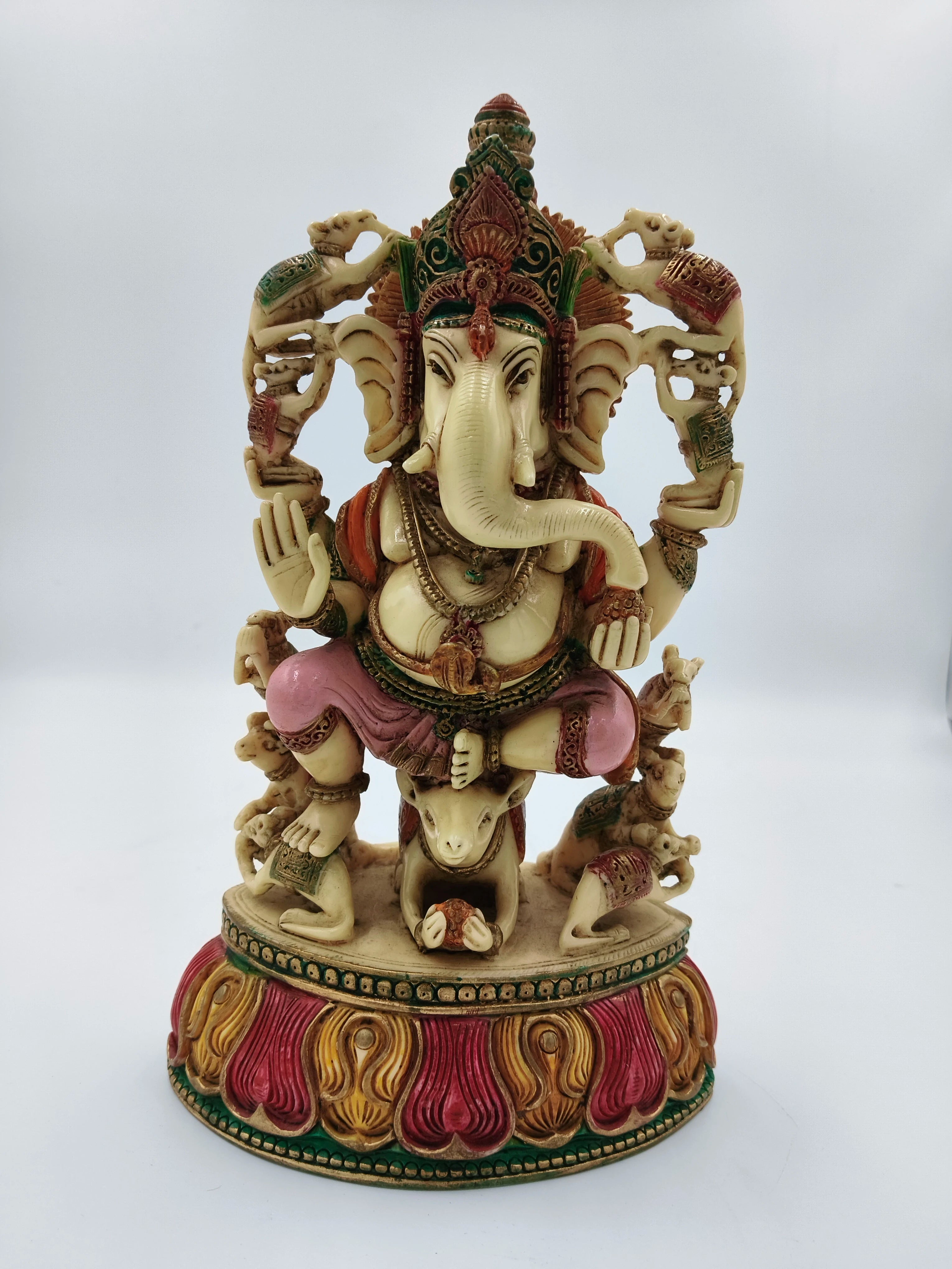 Large polyresin Ganesh statue seated on rat with colorful intricate decorations