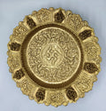 Mini brass decor plate with intricate floral and deity motifs, top view