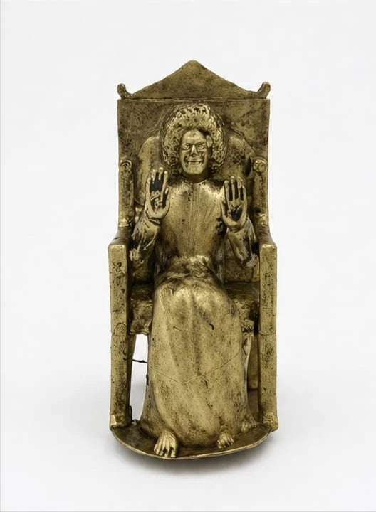 Brass Sai Baba figurine sitting on an ornate chair, front view