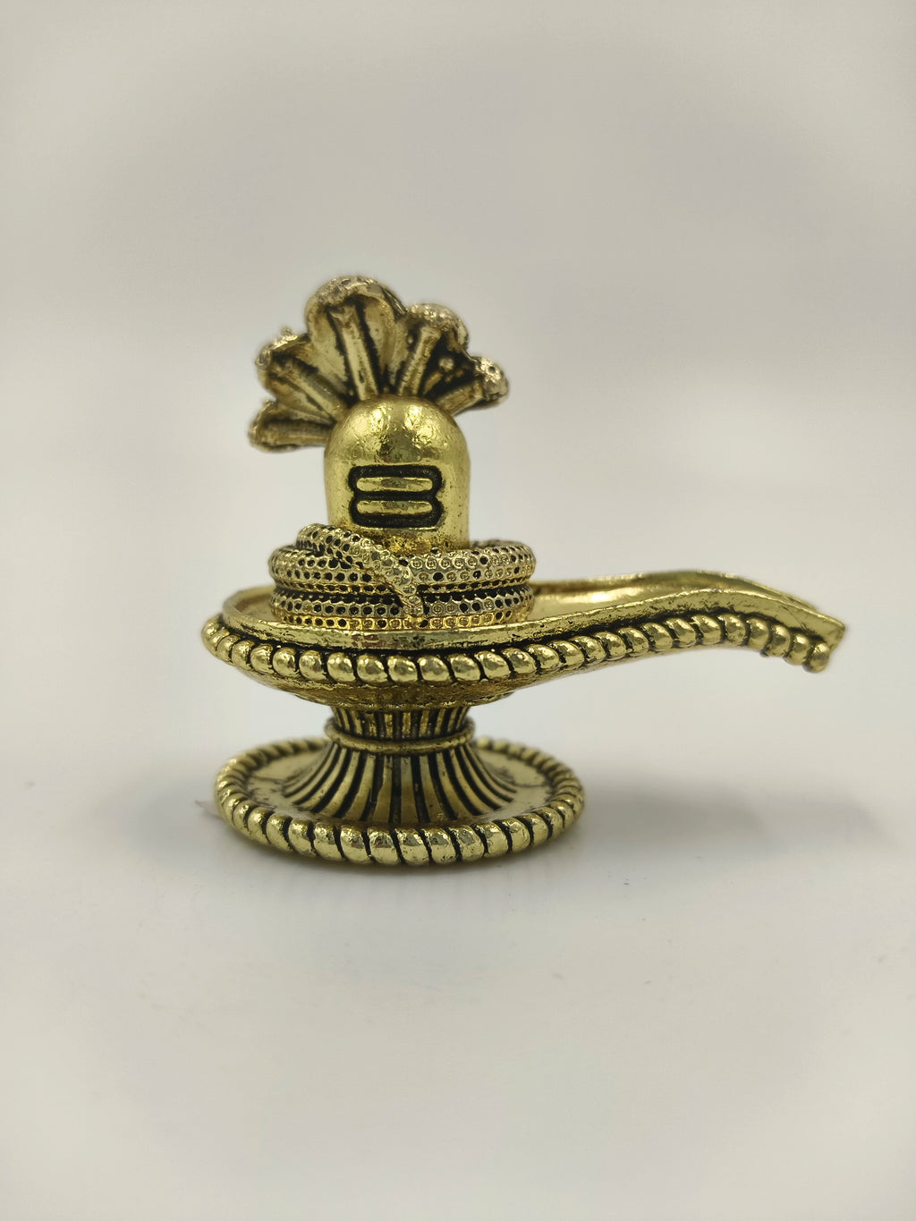 Compact brass Shivalinga sculpture with snake and decorative base