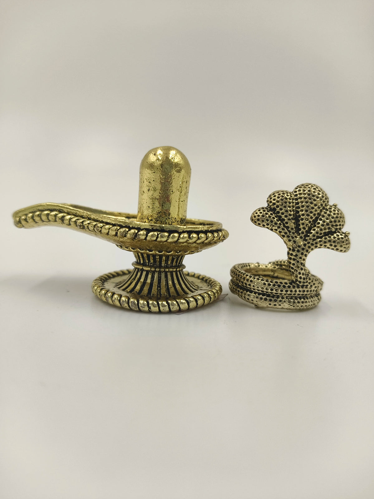 Brass small Shivalinga sculpture with detailed design, front view