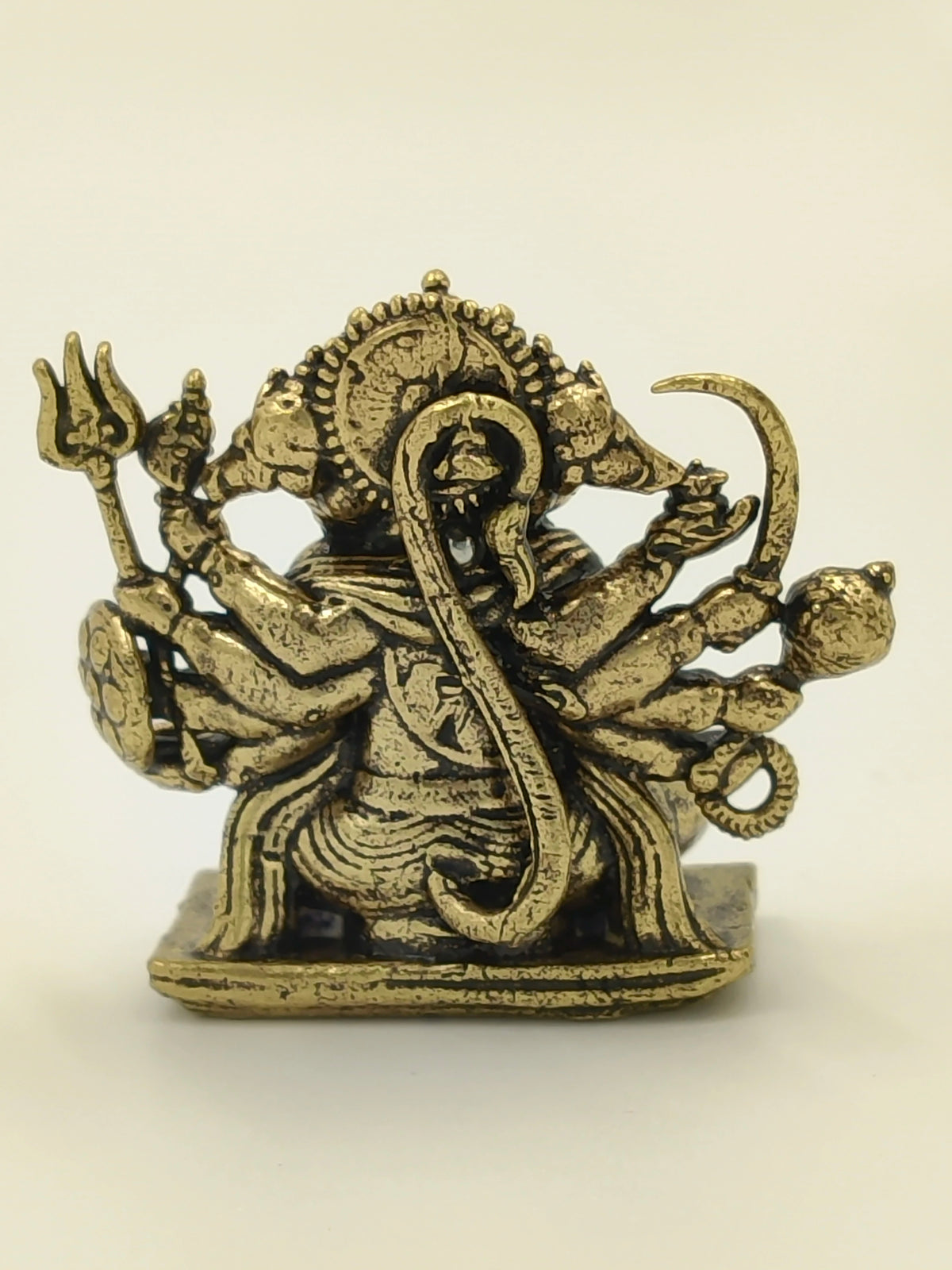 Rear view of brass mini Panchamukhi Hanuman sculpture with multiple arms
