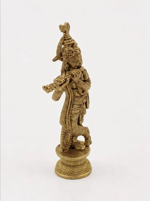 Mini brass sculpture of Krishna playing the flute, detailed carving