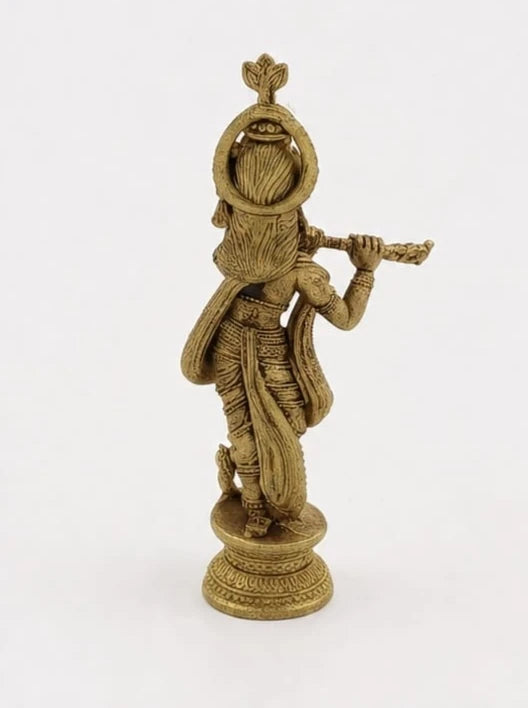 Mini brass Krishna statue playing flute, detailed traditional attire