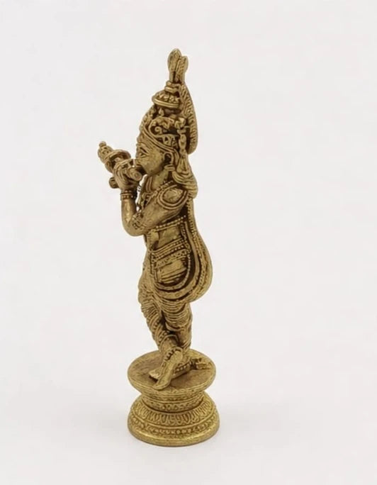 Mini brass statue of Krishna playing flute, side view