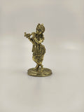 Mini brass statue of Krishna playing flute on round base