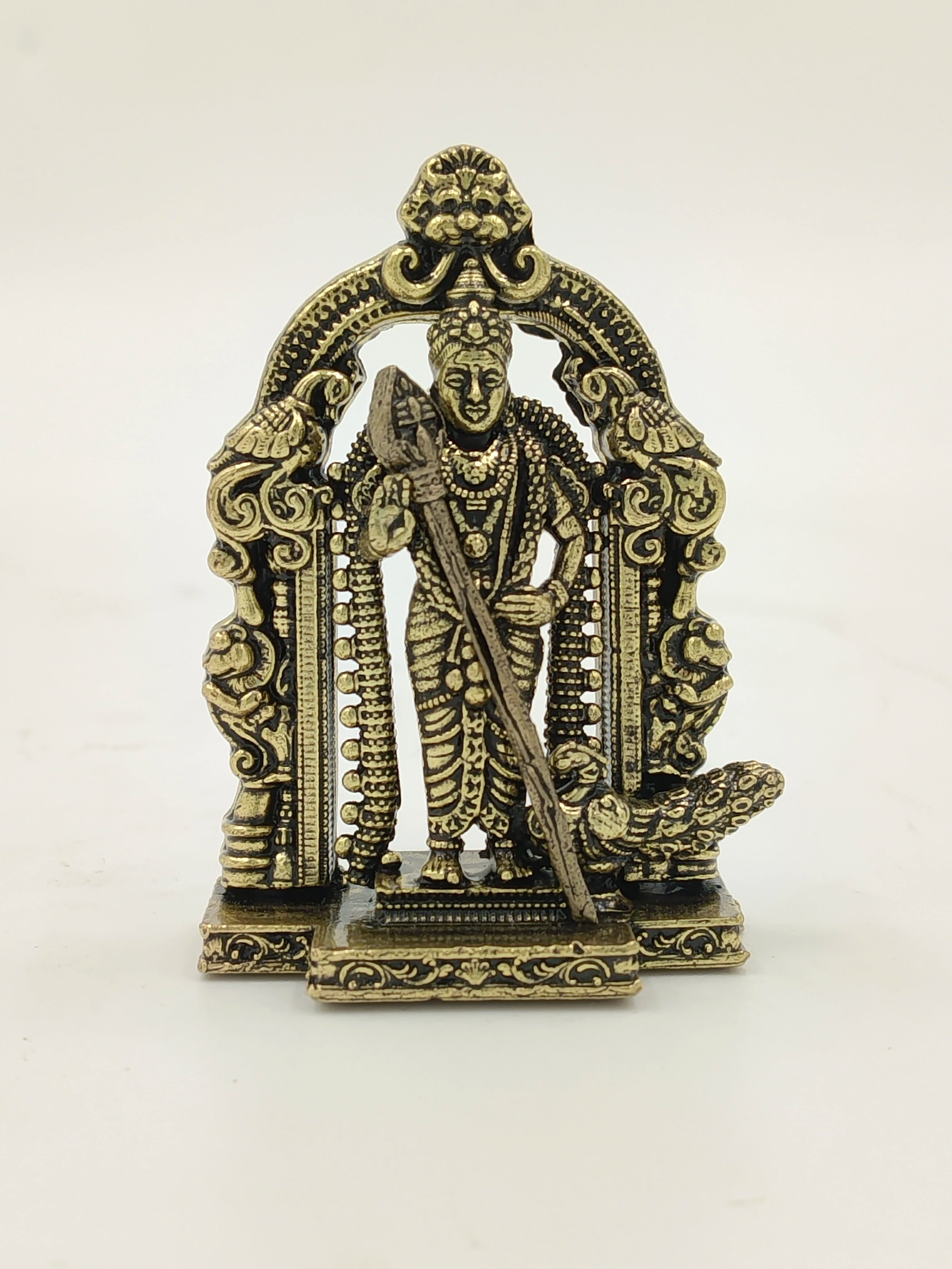 Mini brass statue of deity Murgan under an ornate arch