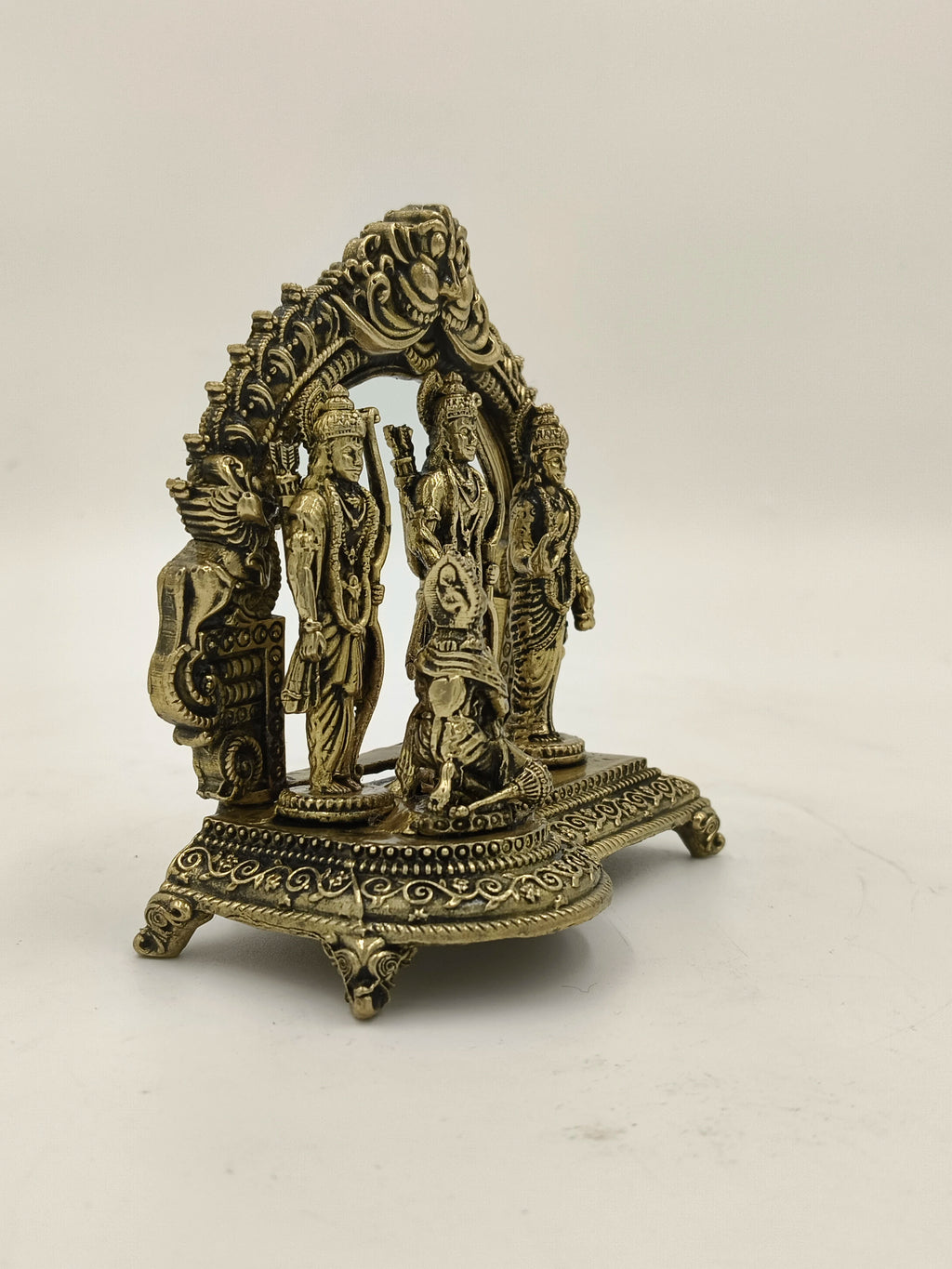 small brass Ram Parivar sculpture with detailed figures and ornamental base
