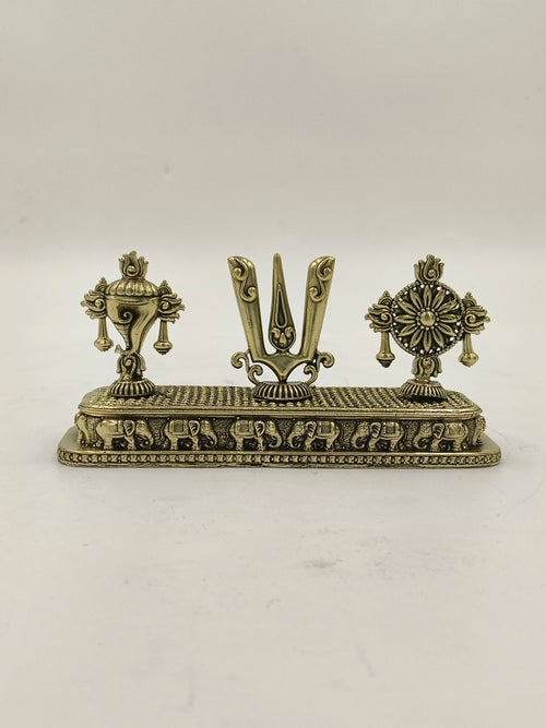 Mini brass sculpture featuring Shankh, Chakra, and Namah symbols on a decorative base