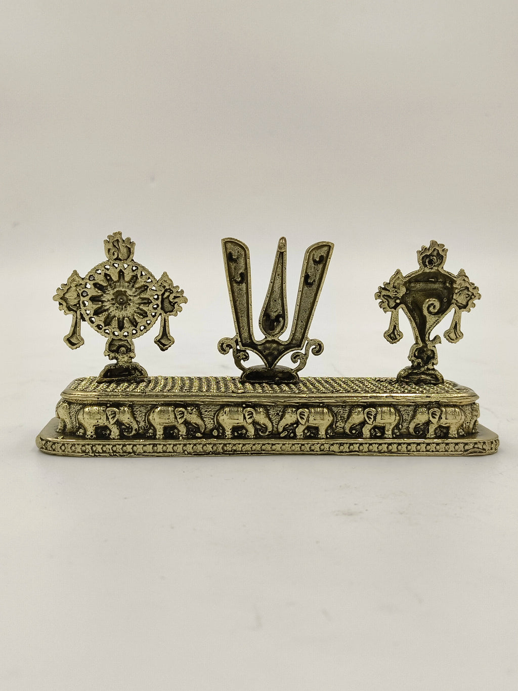 Mini brass Shankh Chakra Namah sculpture with elephant carvings on base