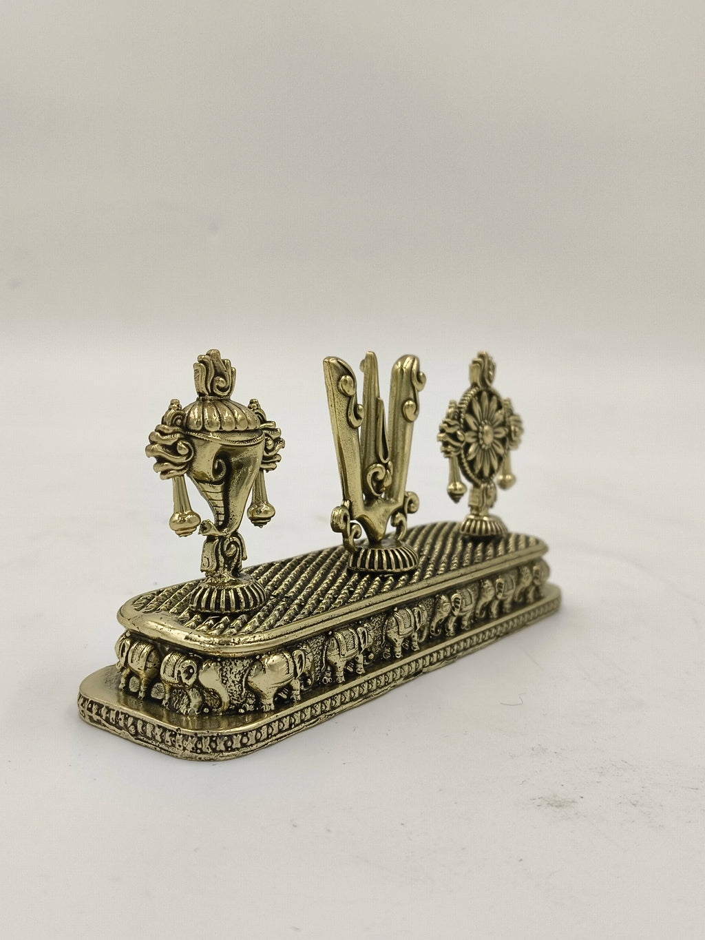 Mini brass Shankh Chakra Namah sculpture with elephant base detailing