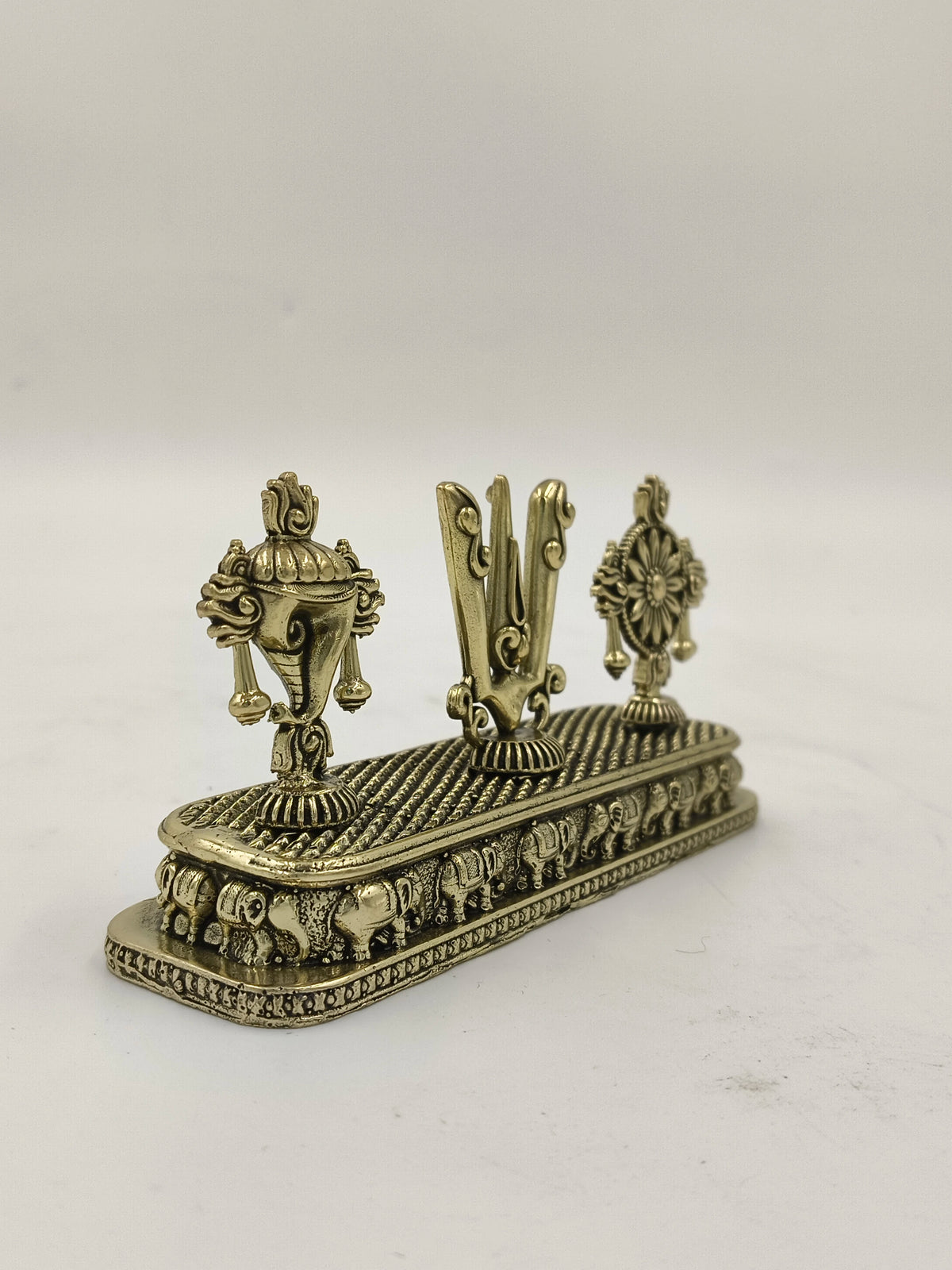 Mini brass Shankh Chakra Namah sculpture with elephant base detailing
