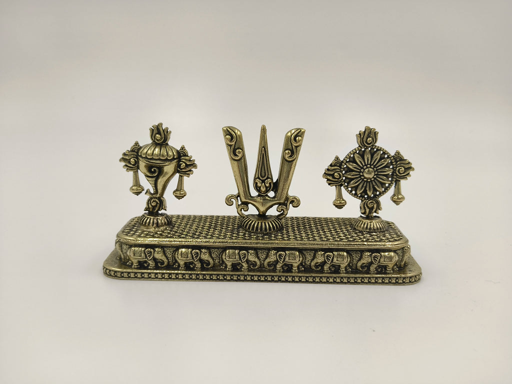 Mini brass sculpture featuring Shankh, Chakra, and Namah symbols on a rectangular base