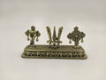 Mini brass sculpture featuring Shankh, Chakra, and Namah symbols on a rectangular base