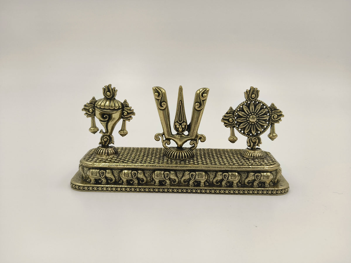 Mini brass sculpture featuring Shankh, Chakra, and Namah symbols on a rectangular base