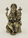 Brass sculpture of Narasimha deity with consort, seated on a decorative base