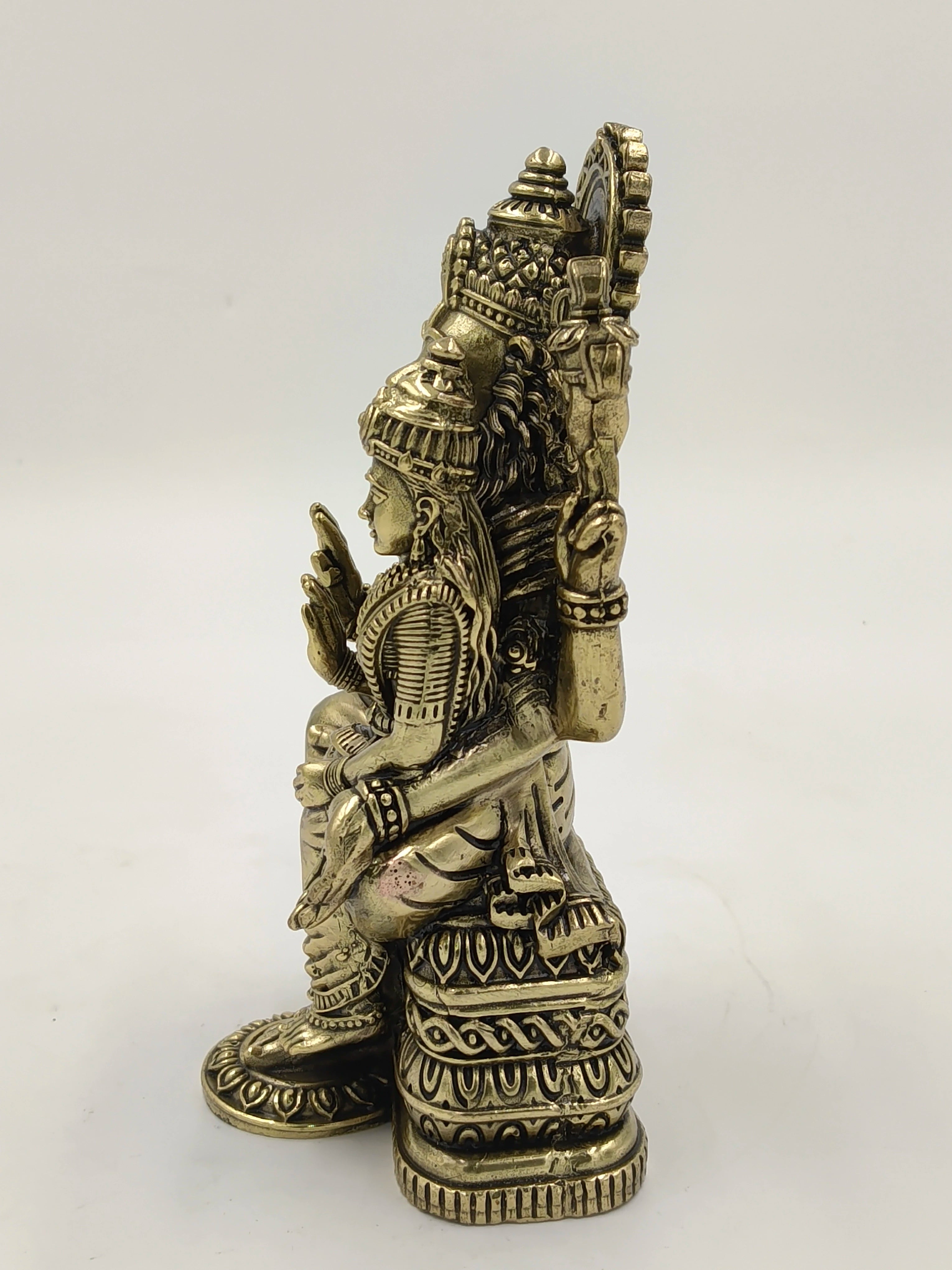 Side view of medium-sized brass Narasimha sculpture with detailed carvings
