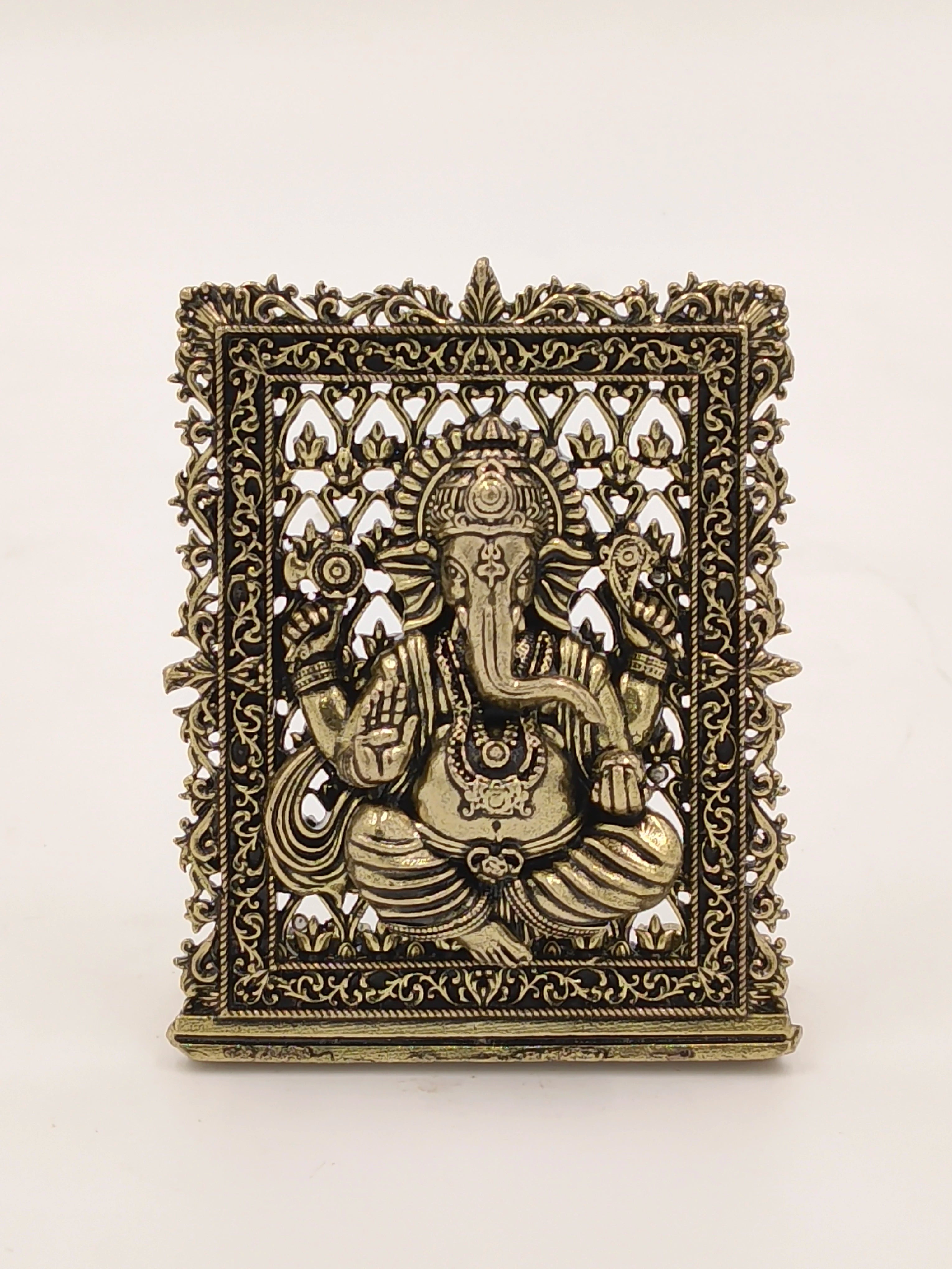 Small brass Ganesh panel with intricate decorative border and detailing