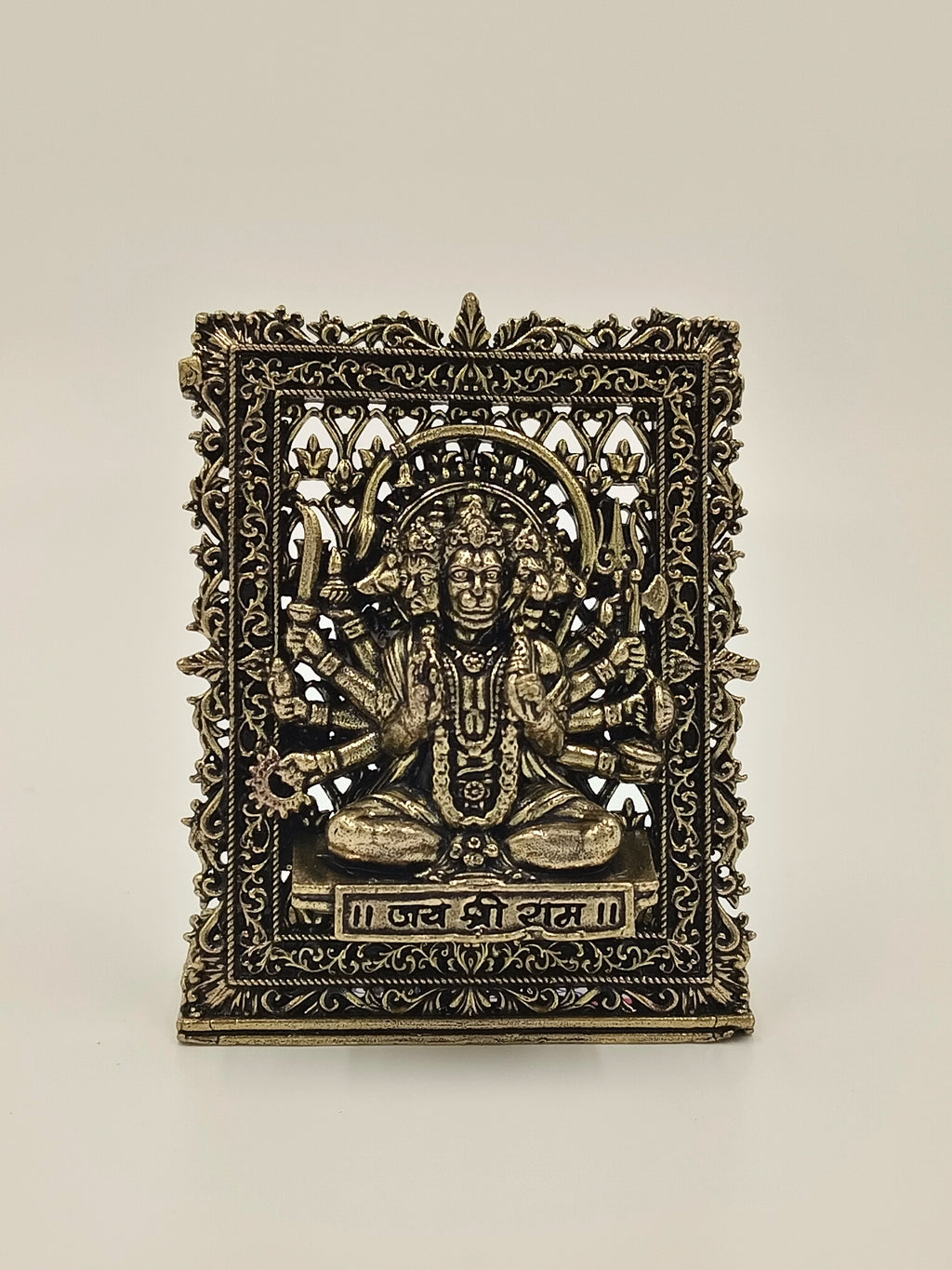 Small brass Panchamukhi Hanuman panel with intricate floral border and inscriptions