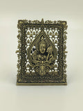 Small brass sculpture panel featuring deity Murgan with intricate floral frame