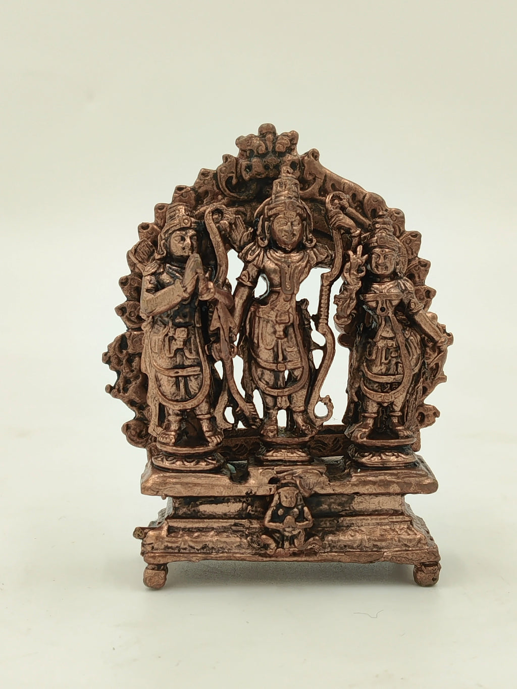 Small brass sculpture of Copper Ram Parivar with three standing figures on a decorative pedestal